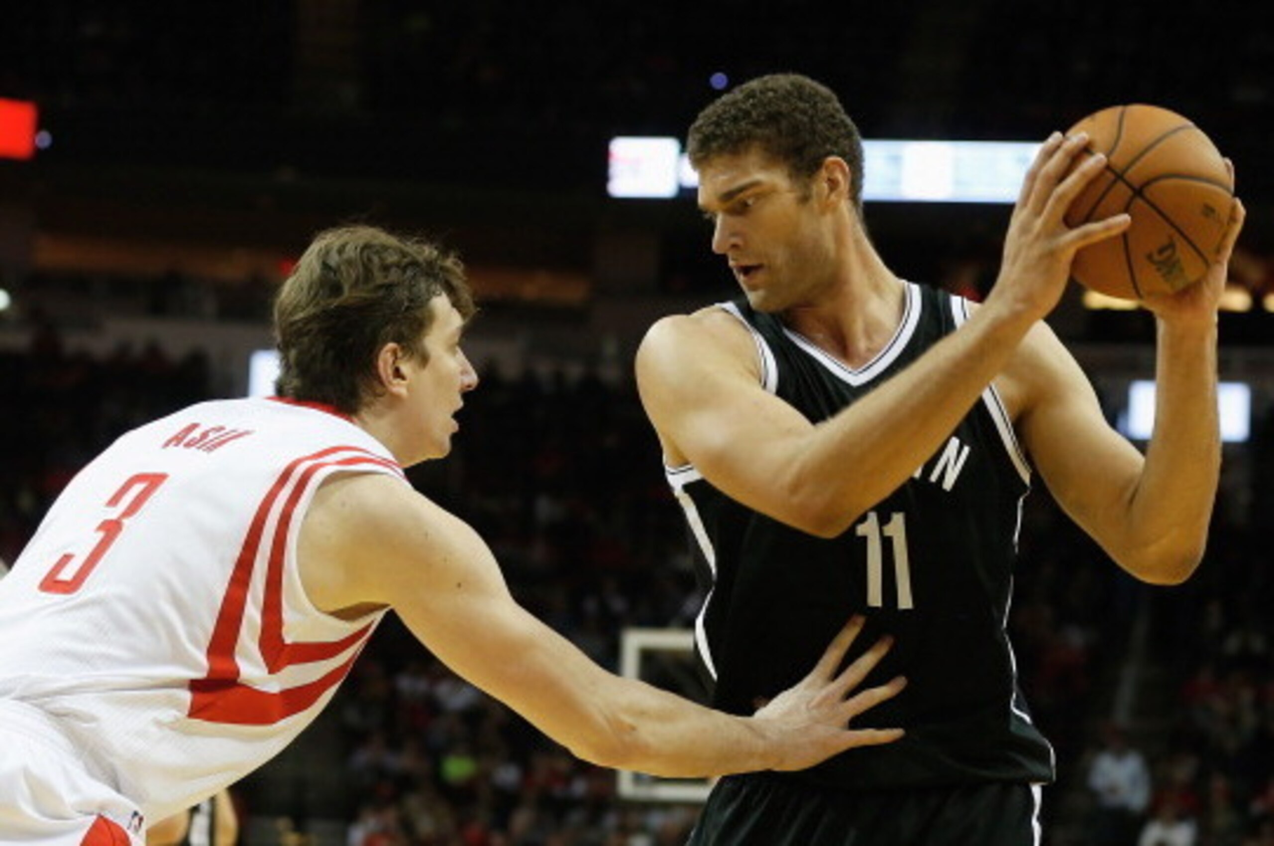 HOUSTON, TX - NOVEMBER 29: Brook Lopez #11 of the Brooklyn Nets works the ball against Omer Asik #3 of the Houston Rockets during the game at Toyota Center on November 29, 2013 in Houston, Texas. NOTE TO USER: User expressly acknowledges and agrees that, HOUSTON, TX - NOVEMBER 29: Brook Lopez #11 of the Brooklyn Nets works the ball against Omer Asik #3 of the Houston Rockets during the game at Toyota Center on November 29, 2013 in Houston, Texas. NOTE TO USER: User expressly acknowledges and agrees that,