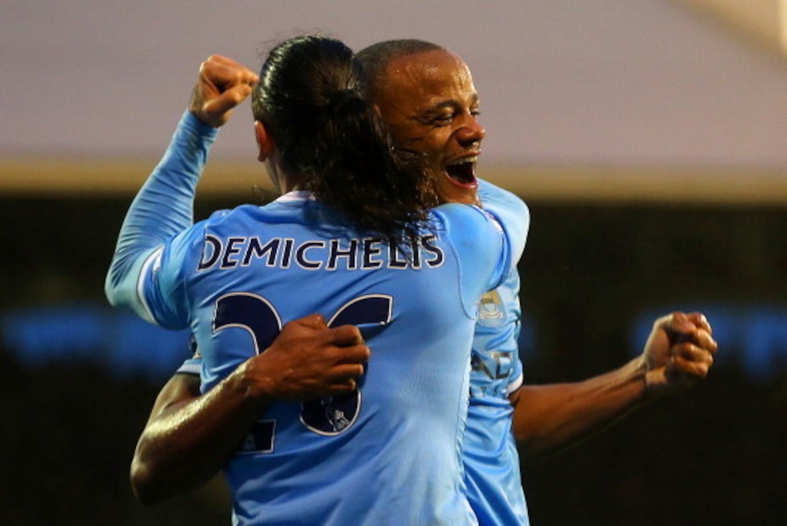 LONDON, ENGLAND - DECEMBER 21:  Vincent Kompany of Manchester City celebrates scoring their second goal with Martin Demichelis of Manchester City during the Barclays Premier League match between Fulham and Manchester City at Craven Cottage on December 21,