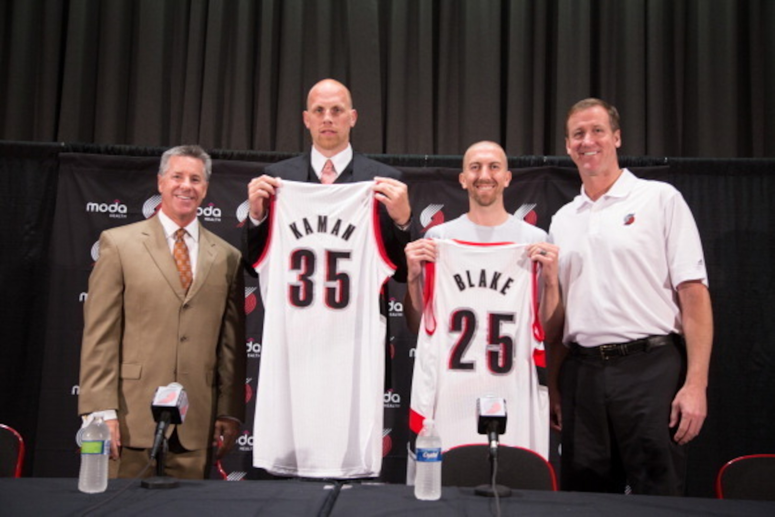 PORTLAND, OR - JULY 10: Newly signed Portland Trail Blazer players Chris Kaman and Steve Blake are introduced  to the media by General Manager Neil Olshey and Head Coach Terry Stotts July 10, 2014 at the Trail Blazer Practice Facility in Portland, Oregon.