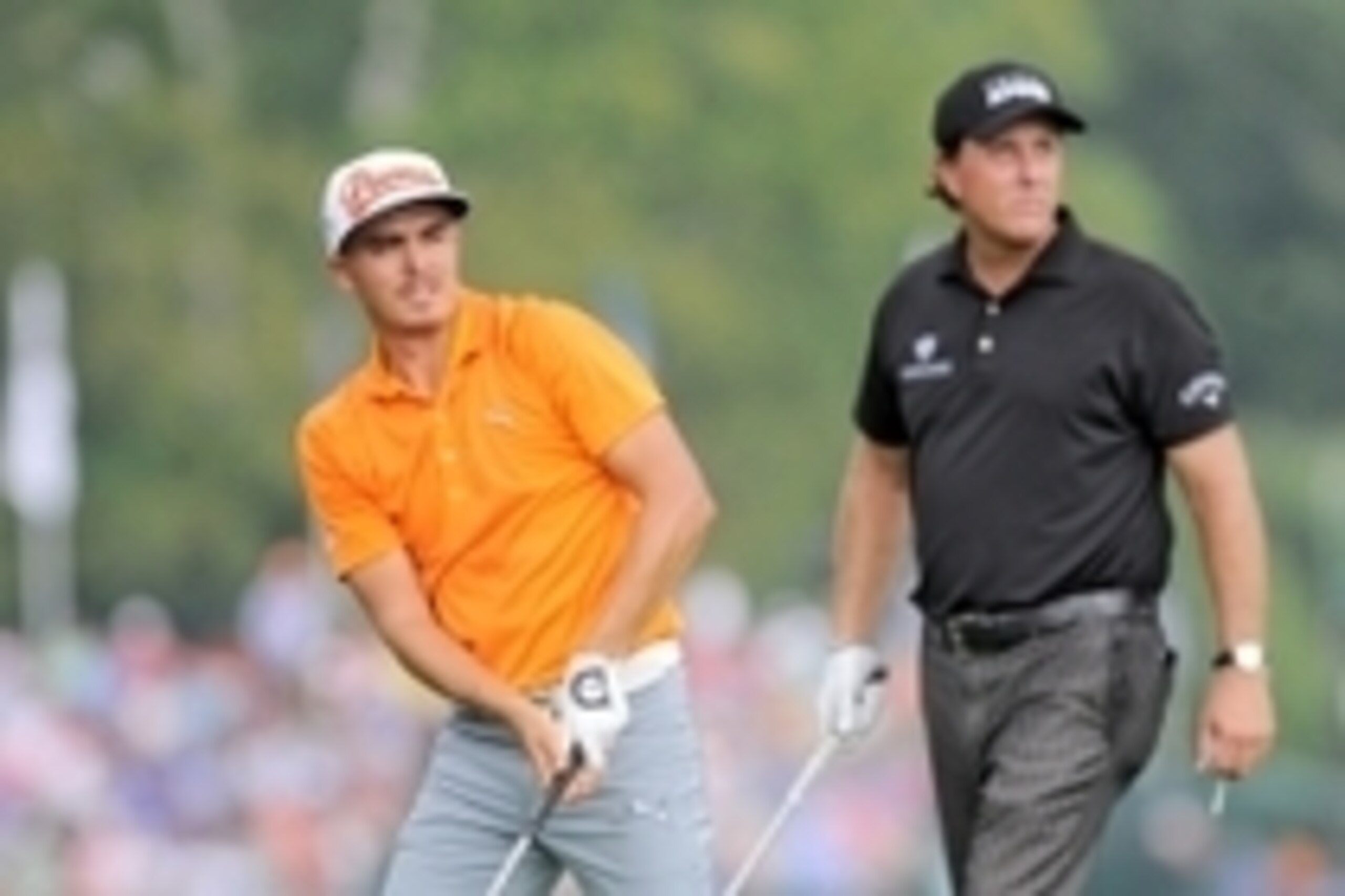Aug 10, 2014; Louisville, KY, USA; PGA golfer Rickie Fowler watches his tee shot on the 5th tee along with playing partner Phil Mickelson during the final round of the 2014 PGA Championship golf tournament at Valhalla Golf Club. Mandatory Credit: Thomas J
