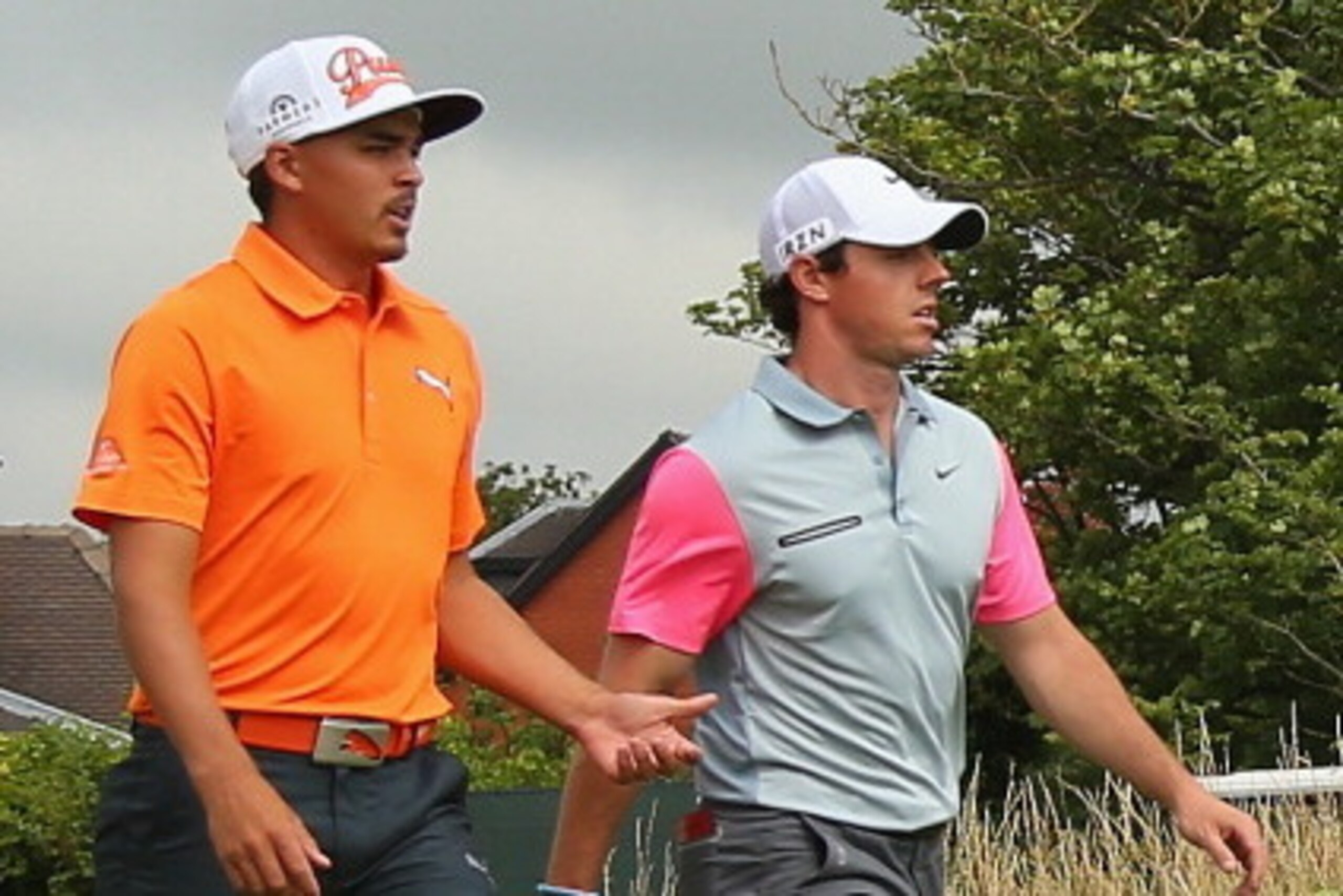 HOYLAKE, ENGLAND - JULY 20:  Rory McIlroy of Northern Ireland and Rickie Fowler of the United States walk together during the final round of The 143rd Open Championship at Royal Liverpool on July 20, 2014 in Hoylake, England.  (Photo by Mike Ehrmann/Getty