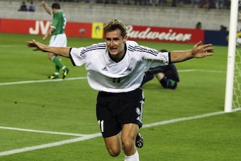IBARAKI - JUNE 5:  Miroslav Klose of Germany celebrates after scoring the first goal during the Germany v Republic of Ireland, Group E, World Cup Group Stage match played at the Ibaraki-Prefectural Kashima Soccer Stadium, Ibaraki, Japan on June 5, 2002. T