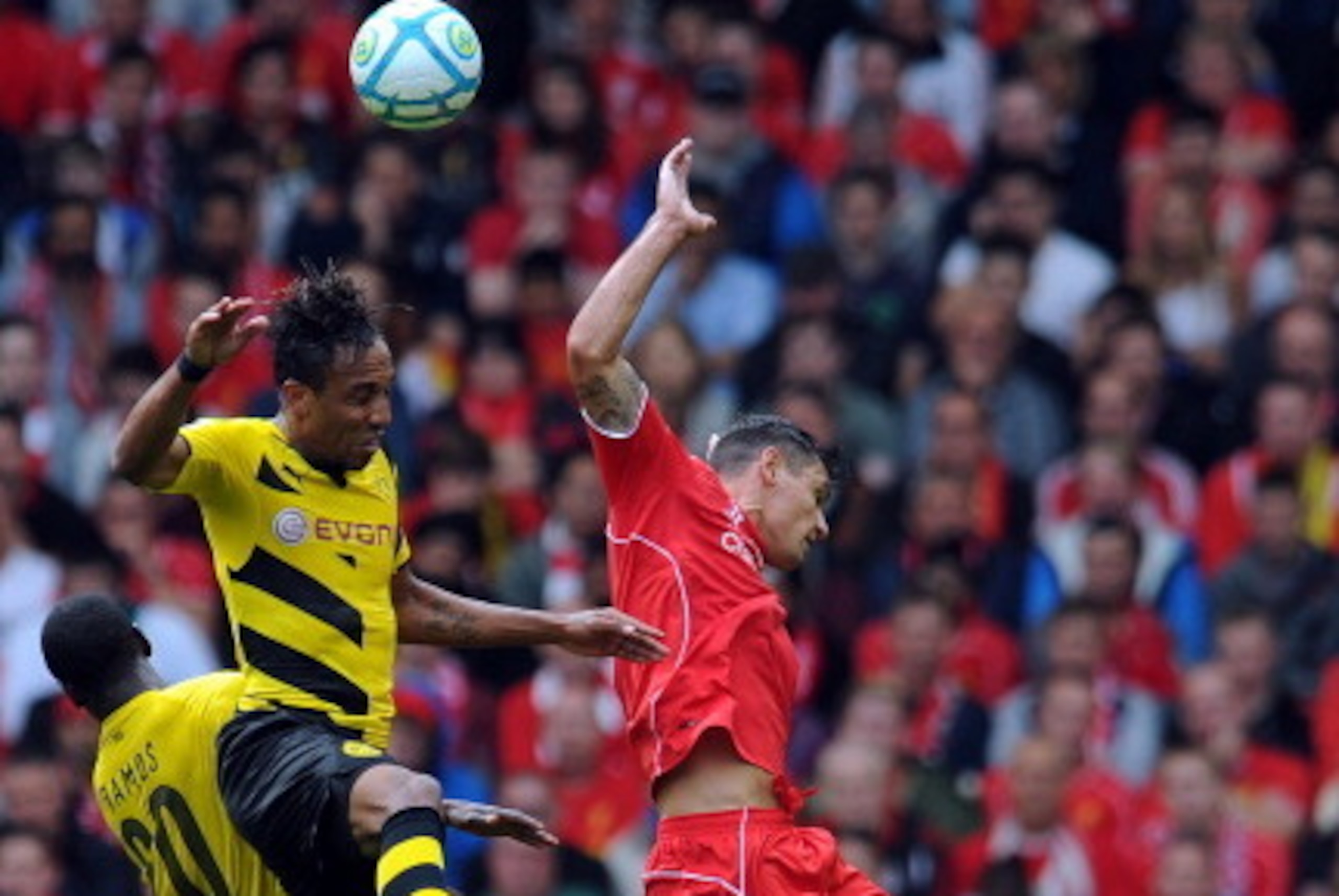 LIVERPOOL, ENGLAND - AUGUST 10:  Dejan Lovren (R) of Liverpool and Pierre Emerick Aubameyang (L) of Borussia Dortmund contest a header during the Pre Season Friendly match between Liverpool and Borussia Dortmund at Anfield on August 10, 2014 in Liverpool,
