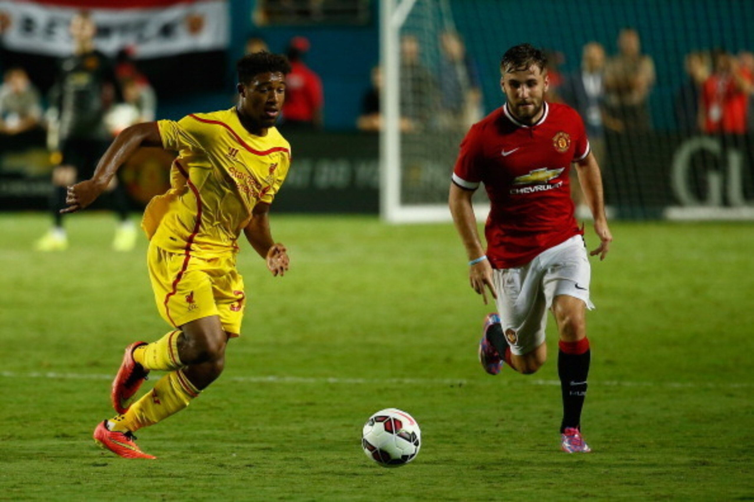 MIAMI GARDENS, FL - AUGUST 04:  Jordon Ibe #33 of Liverpool under pressure from Luke Shaw #28 of Manchester United of the Guinness International Champions Cup 2014 Final at Sun Life Stadium on August 4, 2014 in Miami Gardens, Florida.  (Photo by Chris Tro