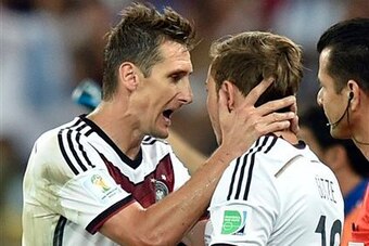 Klose giving Goetze some last-second words of encouragement.