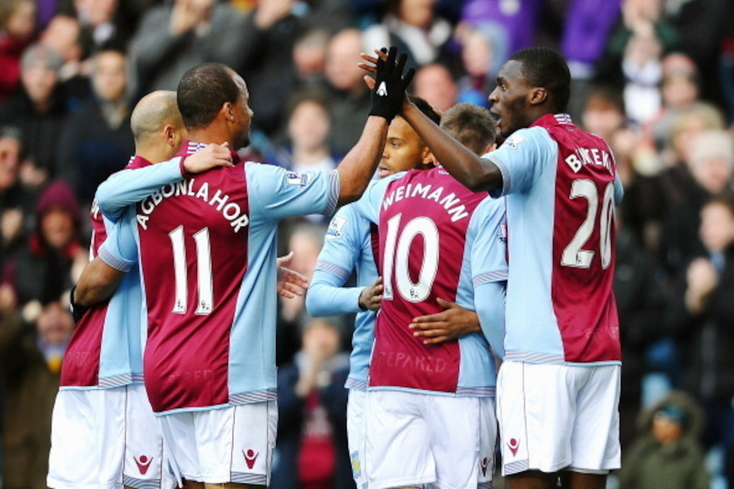 BIRMINGHAM, ENGLAND - MARCH 23:  Christian Benteke #20 (R) of Aston Villa celebrates with teammates after scoring the opening goal during the Barclays Premier League match between Aston Villa and Stoke City at Villa Park on March 23, 2014 in Birmingham, E