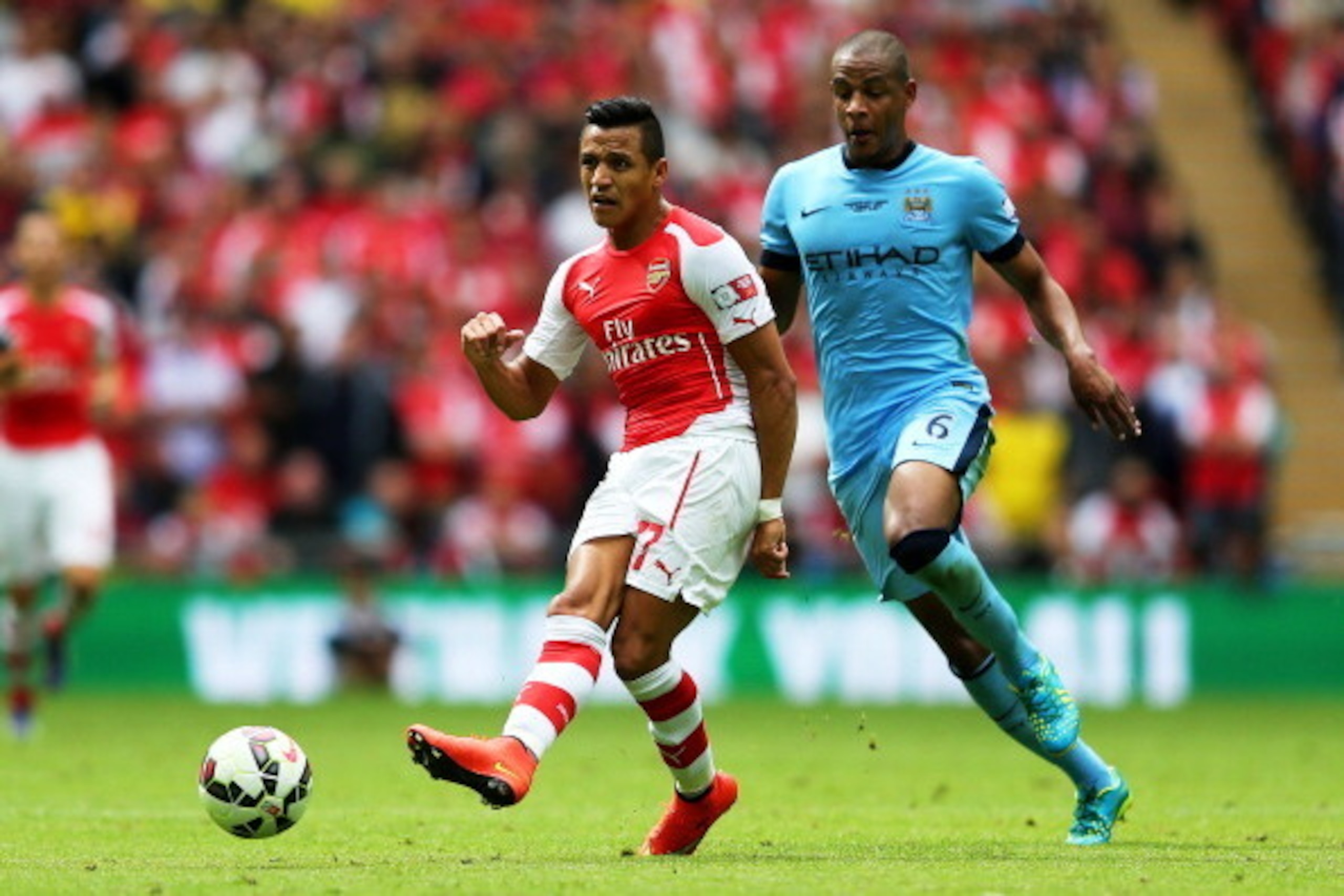 LONDON, ENGLAND - AUGUST 10: Alexis Sanchez of Arsenal in action against Fernando of Manchester City during the FA Community Shield match between Manchester City and Arsenal at Wembley Stadium on August 10, 2014 in London, England. (Photo by Clive Mason/ LONDON, ENGLAND - AUGUST 10: Alexis Sanchez of Arsenal in action against Fernando of Manchester City during the FA Community Shield match between Manchester City and Arsenal at Wembley Stadium on August 10, 2014 in London, England. (Photo by Clive Mason/