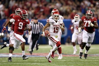 NEW ORLEANS, LA - JANUARY 02:  Zack Sanchez #15 of the Oklahoma Sooners runs with the ball after an interception against the Alabama Crimson Tide during the Allstate Sugar Bowl at the Mercedes-Benz Superdome on January 2, 2014 in New Orleans, Louisiana.  