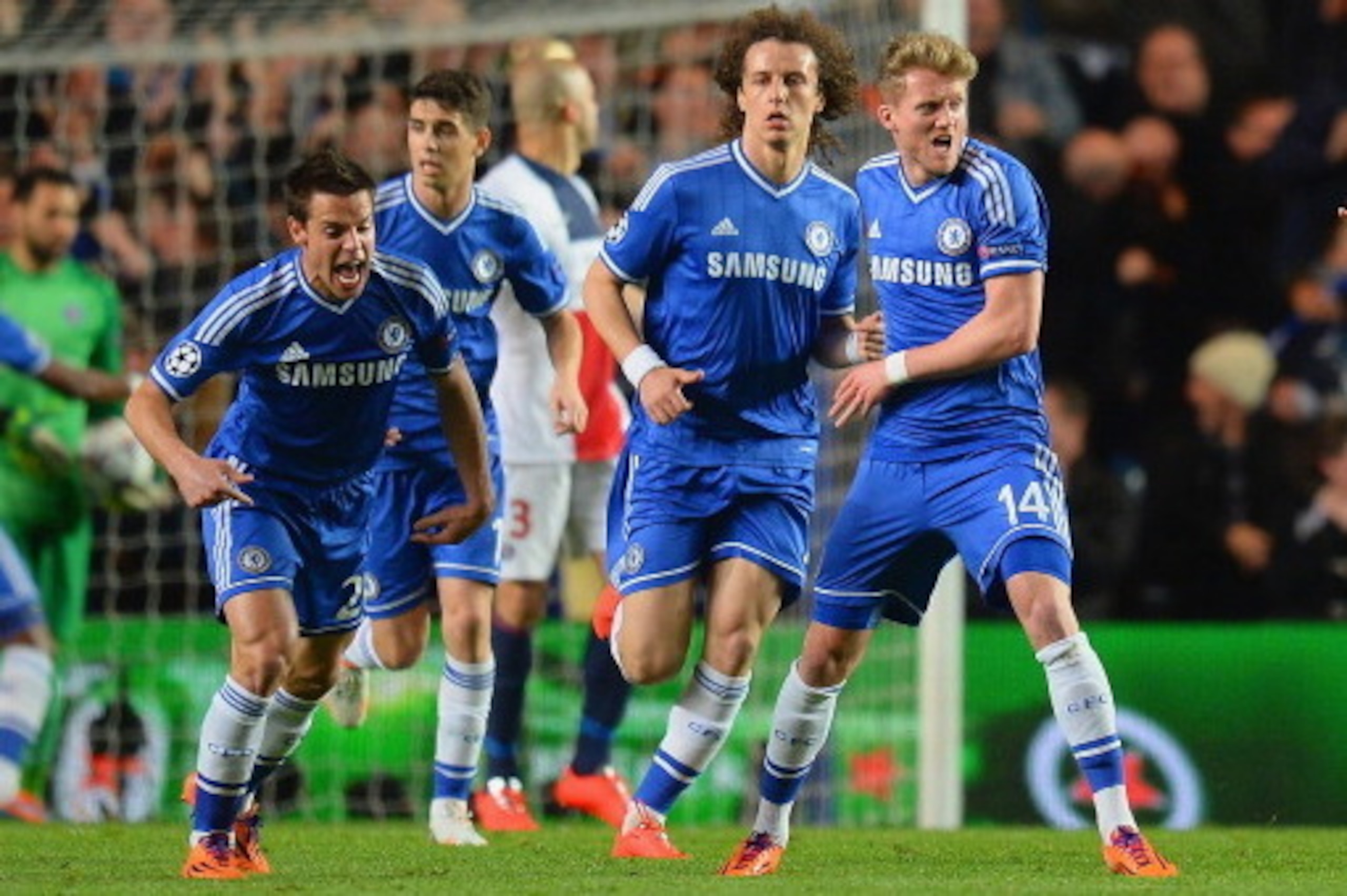 LONDON, ENGLAND - APRIL 08:  Andre Schurrle of Chelsea celebrates scoring their first goal with Cesar Azpilicueta of Chelsea during the UEFA Champions League Quarter Final second leg match between Chelsea and Paris Saint-Germain FC at Stamford Bridge on A