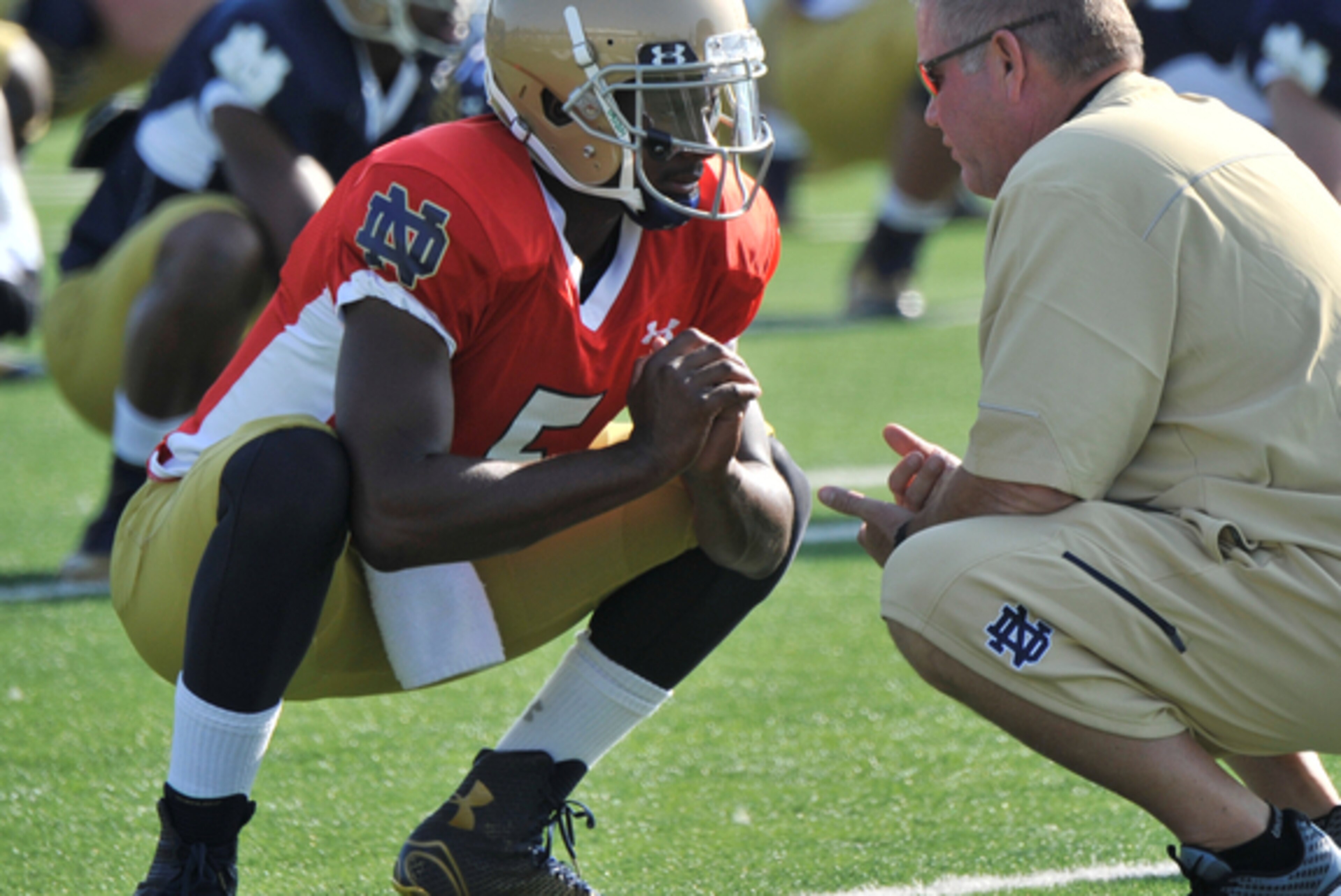 Quarterback Everett Golson and head coach Brian Kelly prepare for practice. Quarterback Everett Golson and head coach Brian Kelly prepare for practice.