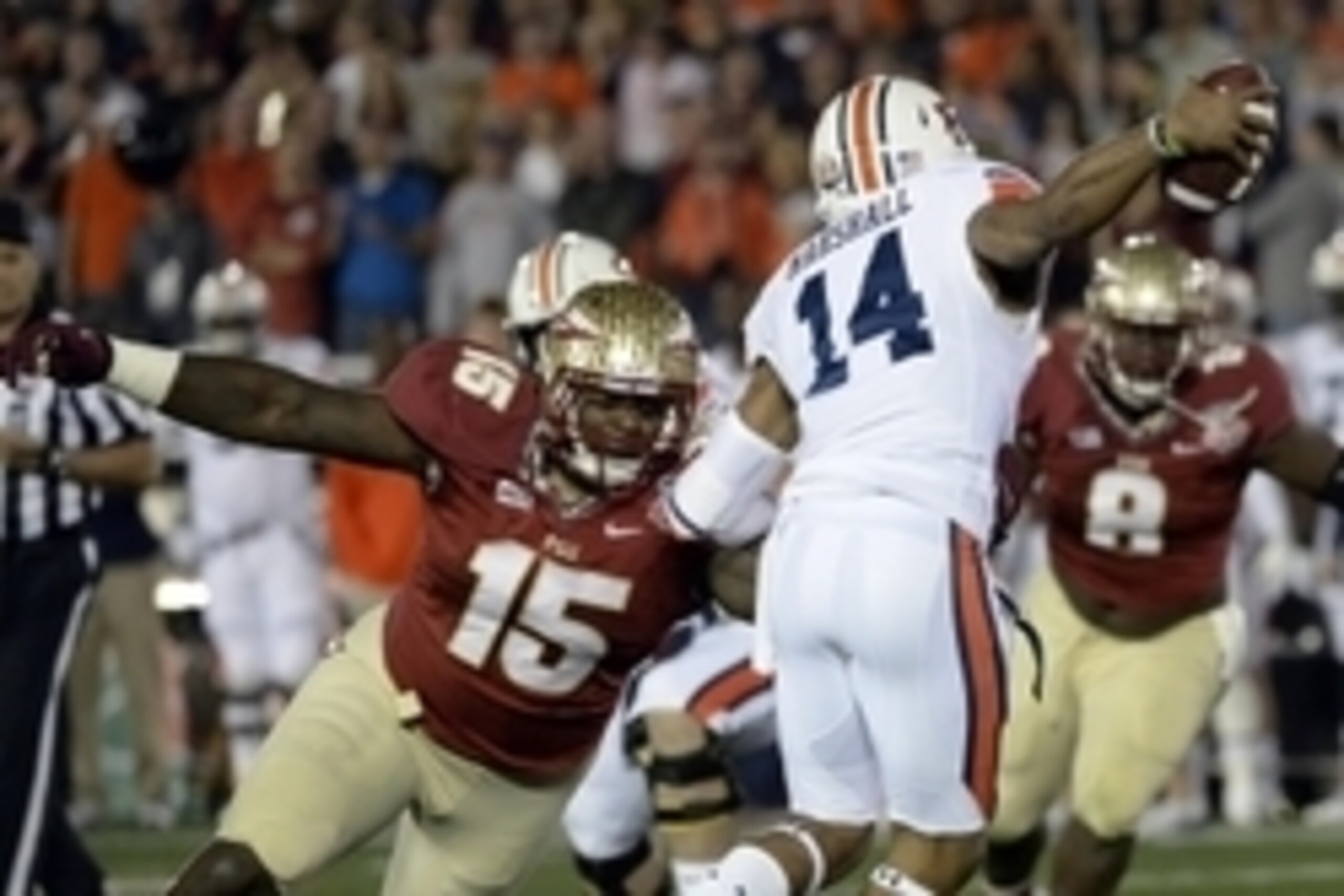 Jan 6, 2014; Pasadena, CA, USA; Florida State Seminoles defensive end Mario Edwards Jr. (15) tries to sack Auburn Tigers quarterback Nick Marshall (14) during the first half of the 2014 BCS National Championship game at the Rose Bowl.  Mandatory Credit: R