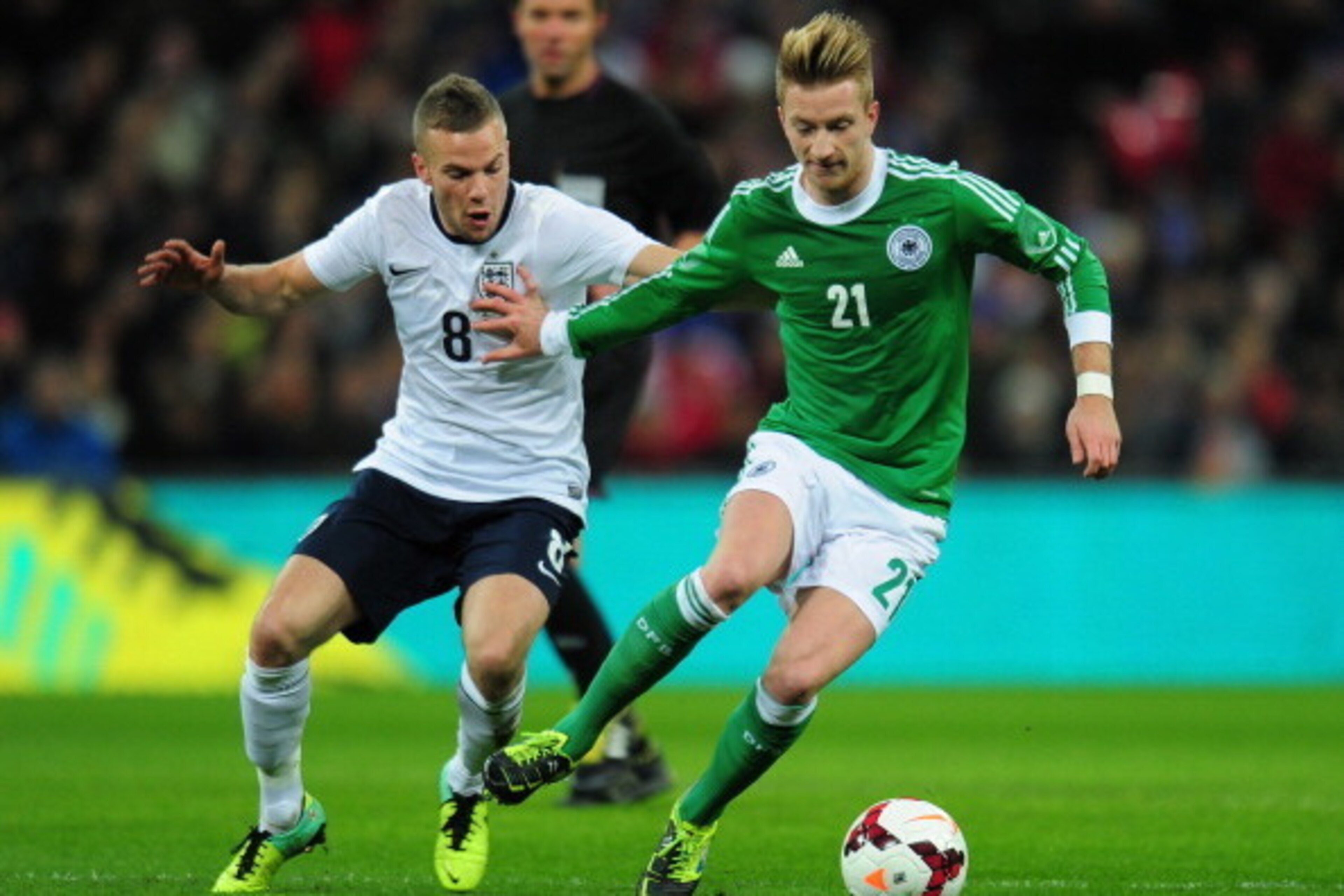 LONDON, ENGLAND - NOVEMBER 19:  Marco Reus of Germany holds off Tom Cleverley of England during the international friendly match between England and Germany at Wembley Stadium on November 19, 2013 in London, England.  (Photo by Shaun Botterill/Getty Image