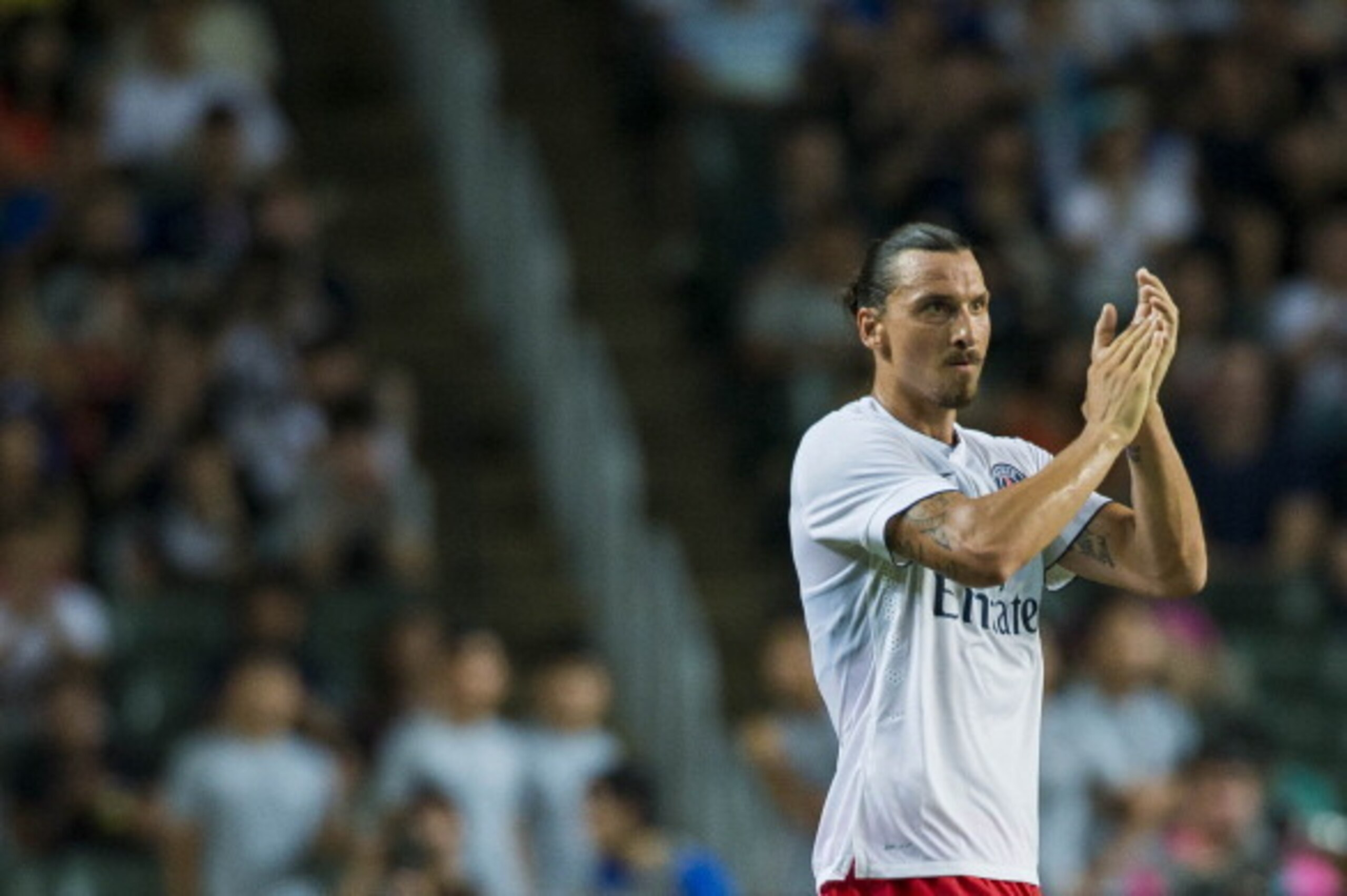 HONG KONG - JULY 29:  Zlatan Ibrahimovic of Paris Saint-Germain acknowledges to the crowd during the friendly match between Kitchee and Paris Saint-Germain at Hong Kong Stadium on July 29, 2014 in Hong Kong, Hong Kong.  (Photo by Victor Fraile/Getty Image