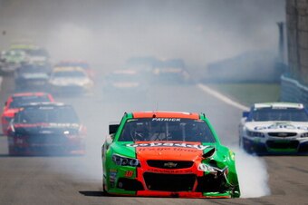 WATKINS GLEN, NY - AUGUST 10:  Smoke pours from the #10 GoDaddy Chevrolet, driven by Danica Patrick, after an on-track incident during the NASCAR Sprint Cup Series Cheez-It 355 at Watkins Glen International on August 10, 2014 in Watkins Glen, New York.  (