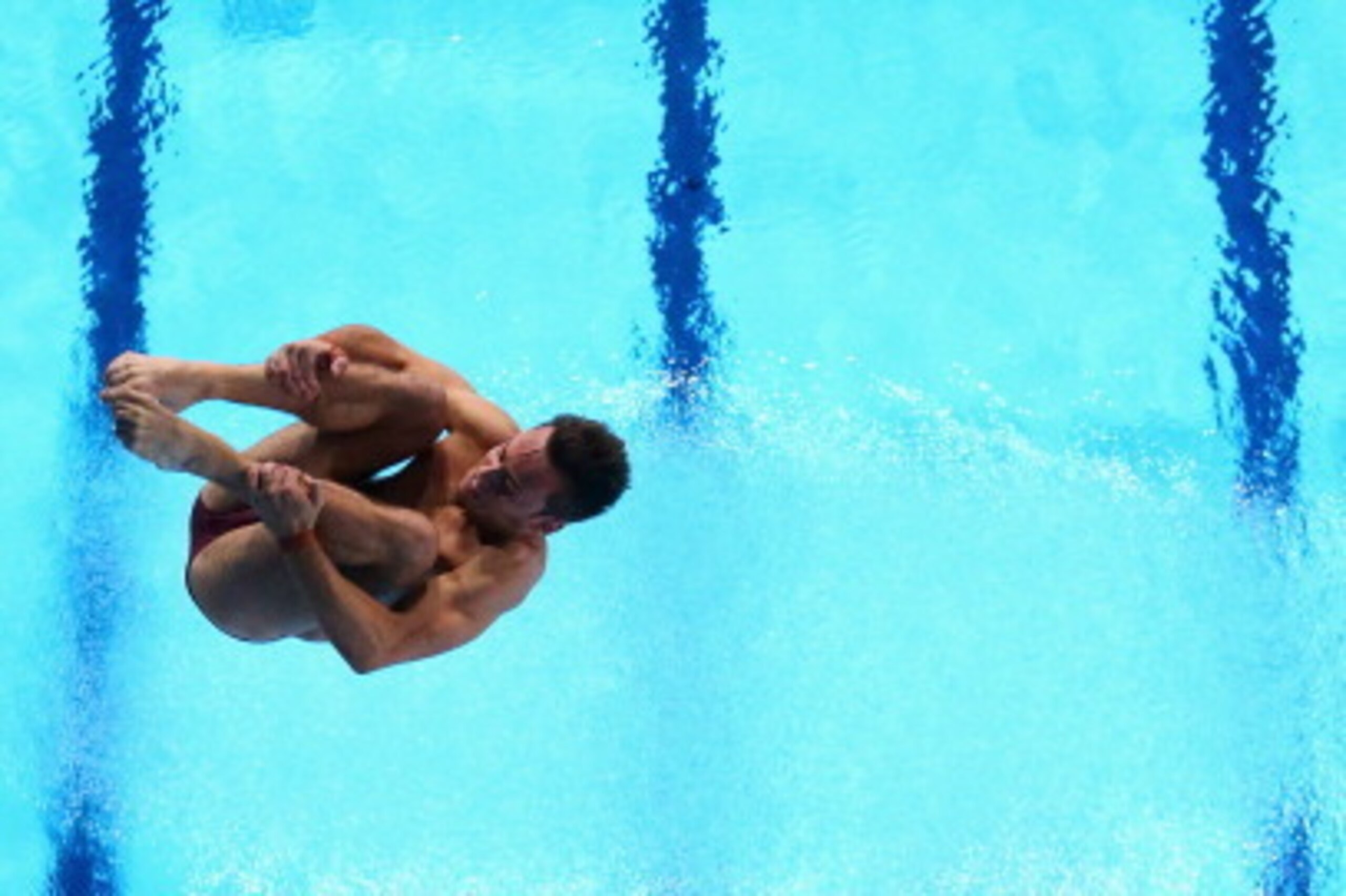 EDINBURGH, SCOTLAND - AUGUST 02:  Tom Daley of England competes in the Men's 10m Platform Preliminaries at Royal Commonwealth Pool during day ten of the Glasgow 2014 Commonwealth Games on August 2, 2014 in Edinburgh, United Kingdo  (Photo by Quinn Rooney/