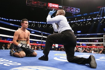 BROOKLYN, NY - AUGUST 9: Referee Steve Willis counts after Rod Salka (Black/Gold trunks) was knocked down by Danny Garcia during their fight at the Barclays Center on August 9, 2014 in Brooklyn, New York. (Photo by Ed Mulholland/Getty Images)