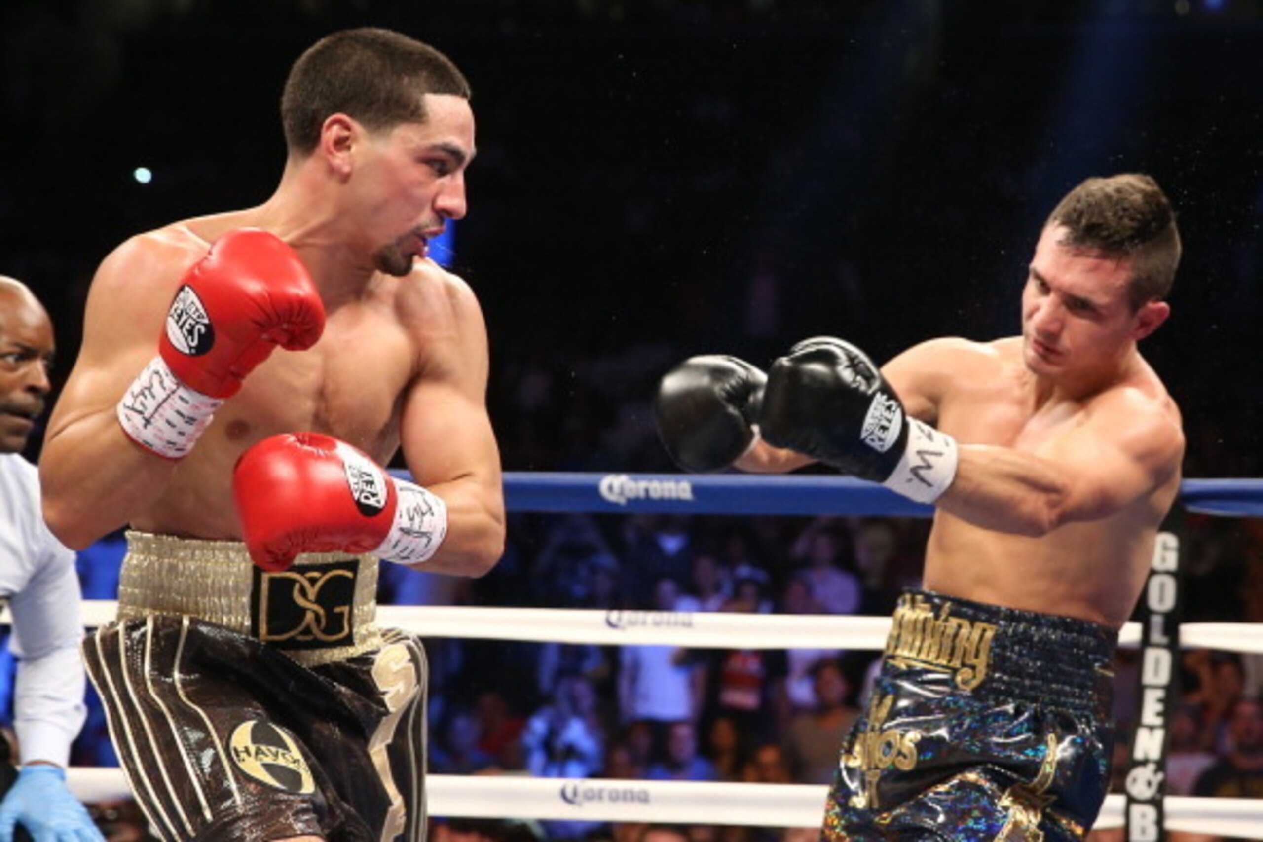 BROOKLYN, NY - AUGUST 9: Danny Garcia (Brown/Gold trunks) lands a left hook to the head of Rod Salka (Black/Gold trunks) during their fight at the Barclays Center on August 9, 2014 in Brooklyn, New York. (Photo by Ed Mulholland/Getty Images)