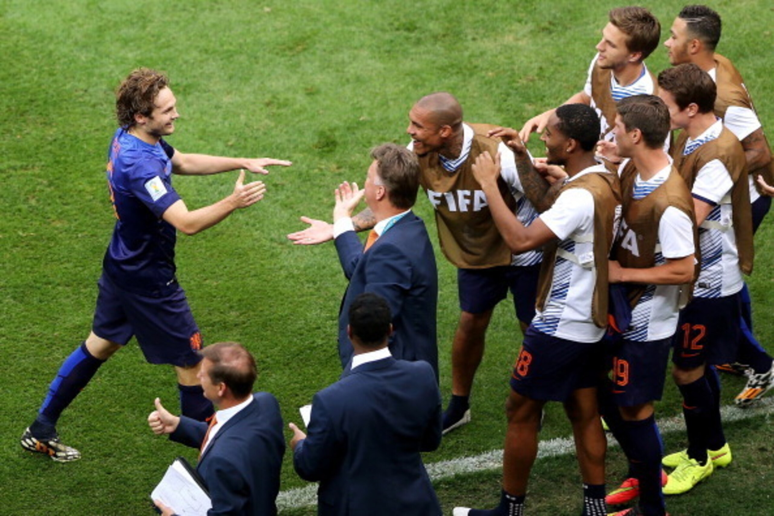 BRASILIA, BRAZIL - JULY 12:  Daley Blind of the Netherlands celebrates scoring his team's second goal with teammates and head coach Louis van Gaal during the 2014 FIFA World Cup Brazil Third Place Playoff match between Brazil and the Netherlands at Estadi