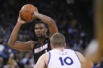 Feb 12, 2014; Oakland, CA, USA; Miami Heat center Chris Bosh (1) looks to pass the ball against the Golden State Warriors in the second quarter at Oracle Arena. Mandatory Credit: Cary Edmondson-USA TODAY Sports