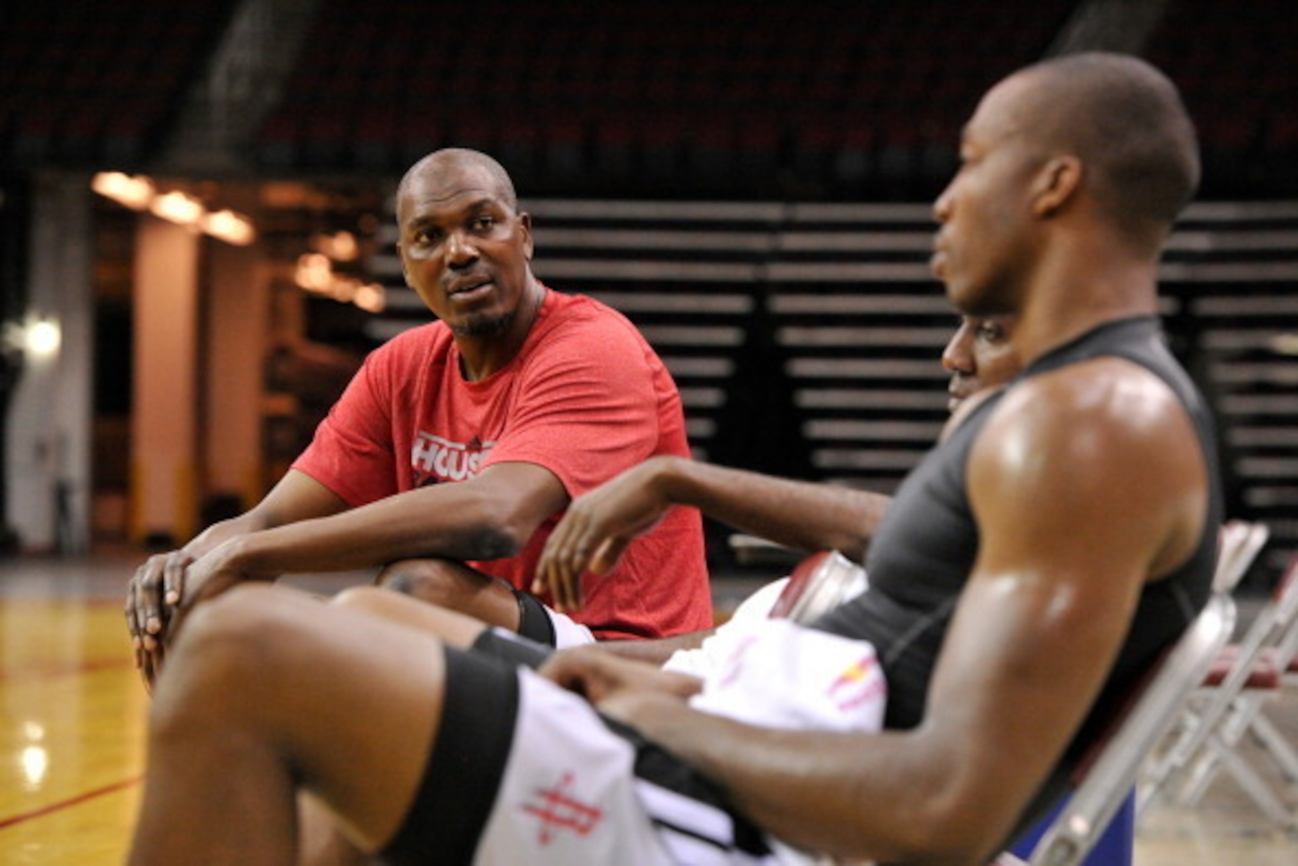 HOUSTON, TX - JULY 13, 2013: Legend Hakeem Olajuwon talks with Dwight Howard of the Houston Rockets after they work out on August 13, 2013 at The Toyota Center Houston, Texas. NOTE TO USER: User expressly acknowledges and agrees that, by downloading and o