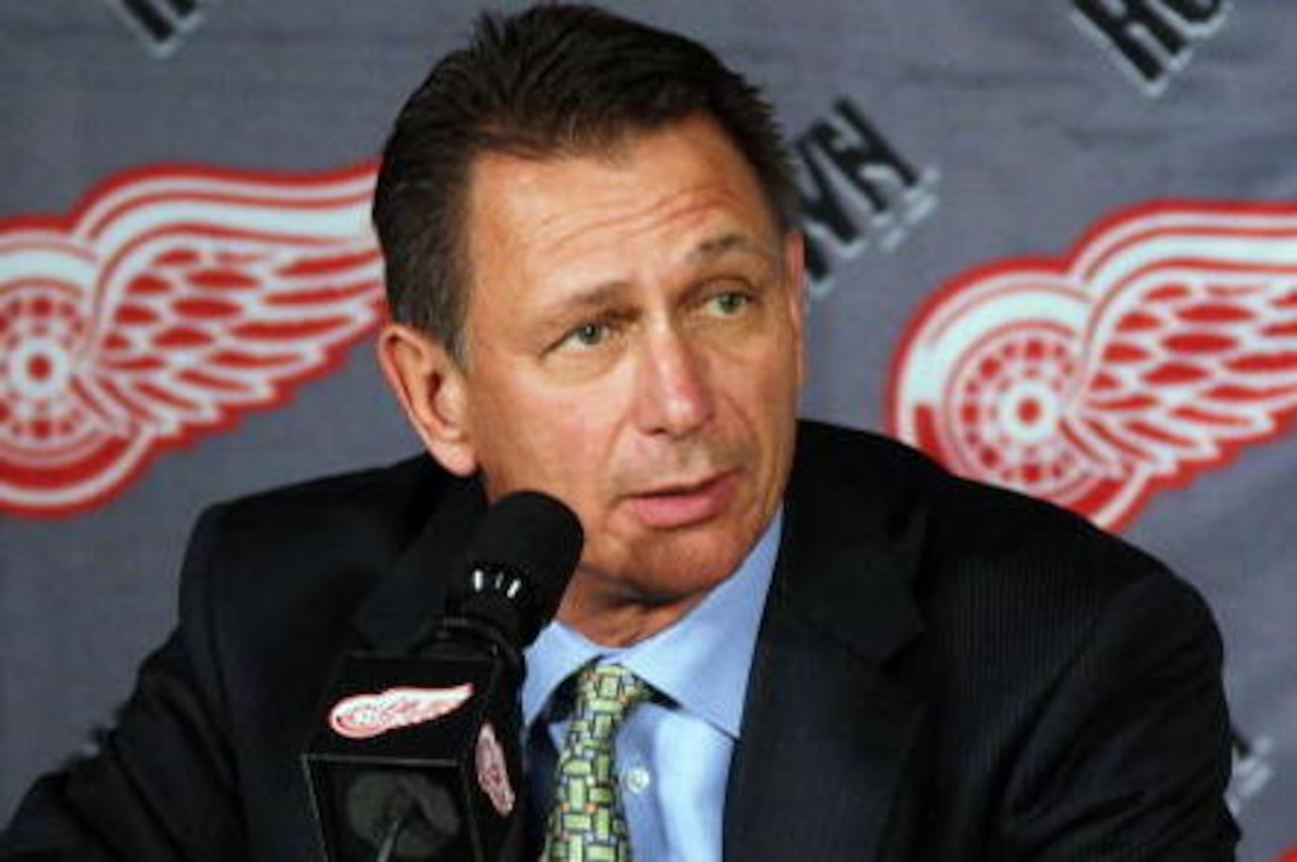 DETROIT - OCTOBER 12:  Executive Vice President and General Manager, Ken Holland of the Detroit Red Wings address the media during a press conference to announce the retirement from hockey of Kirk Maltby #18 before a NHL game against the Colorado Avalanch