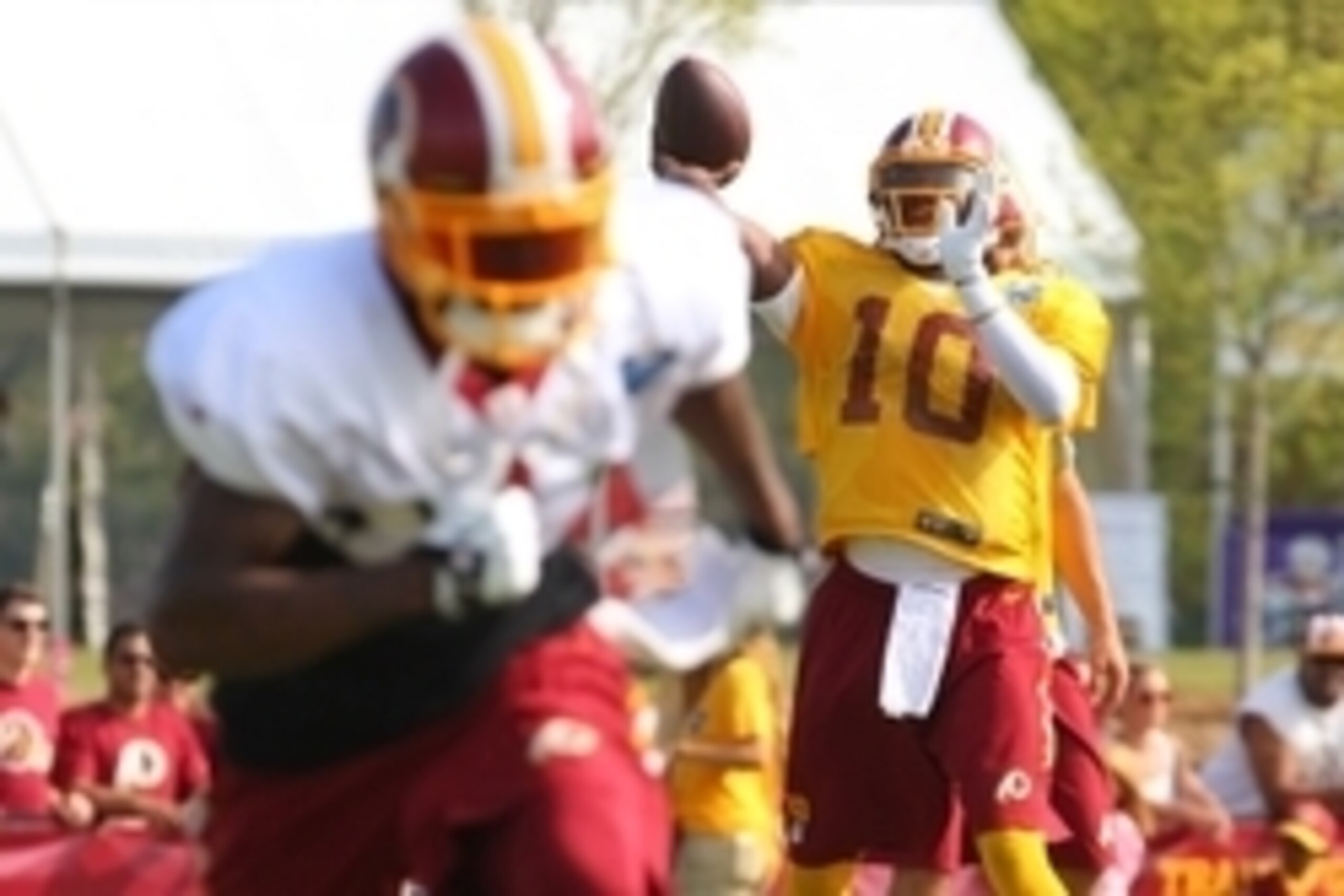 Jul 25, 2014; Richmond, VA, USA; Washington Redskins quarterback Robert Griffin III (10) throws the ball to Redskins wide receiver DeSean Jackson (1) during practice on day three of training camp at Bon Secours Washington Redskins Training Center. Mandato Jul 25, 2014; Richmond, VA, USA; Washington Redskins quarterback Robert Griffin III (10) throws the ball to Redskins wide receiver DeSean Jackson (1) during practice on day three of training camp at Bon Secours Washington Redskins Training Center. Mandato