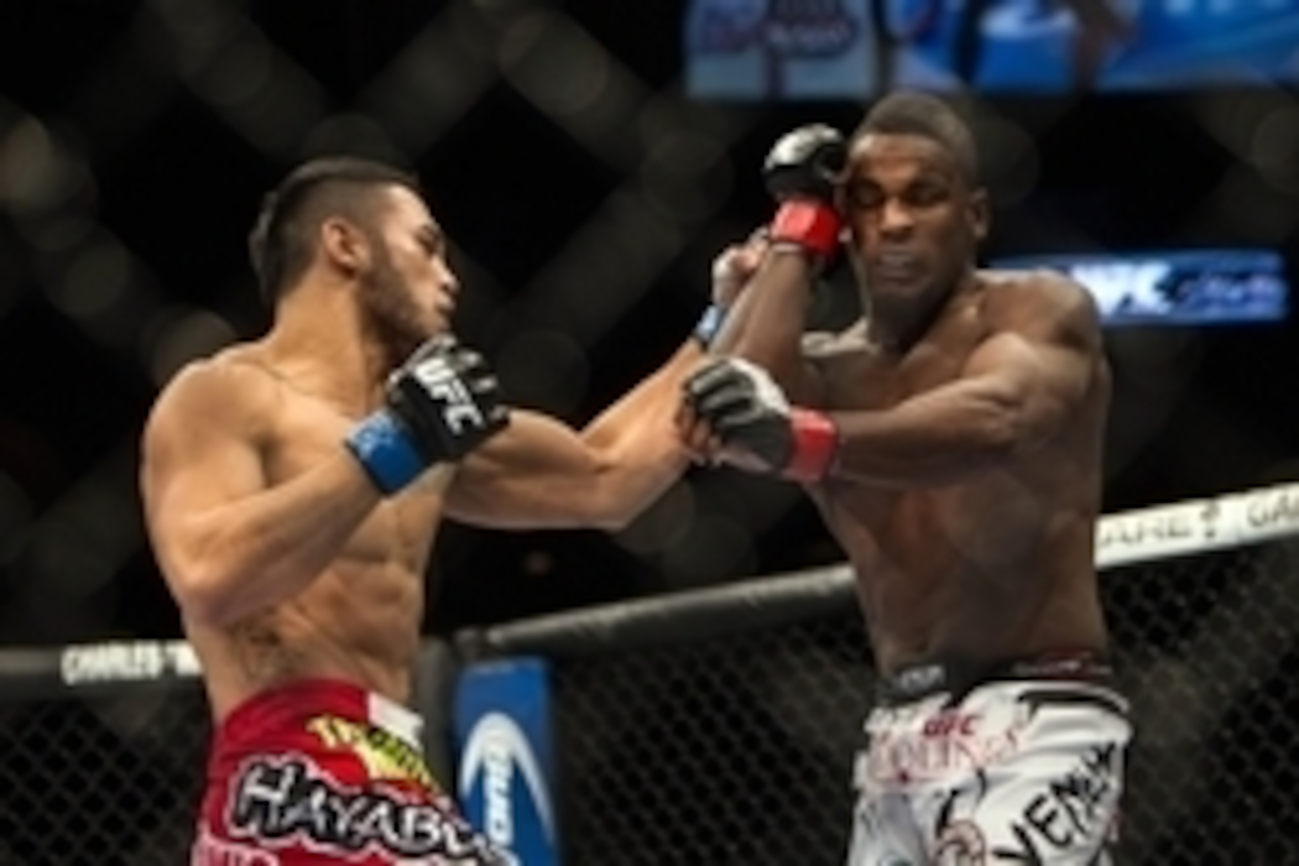 Jan 15, 2014; Duluth, GA, USA; Lorenz Larkin (red gloves) fights Brad Tavares (blue gloves) during UFC Fight Night at Gwinnett Center. Mandatory Credit: Joshua S. Kelly-USA TODAY Sports Jan 15, 2014; Duluth, GA, USA; Lorenz Larkin (red gloves) fights Brad Tavares (blue gloves) during UFC Fight Night at Gwinnett Center. Mandatory Credit: Joshua S. Kelly-USA TODAY Sports