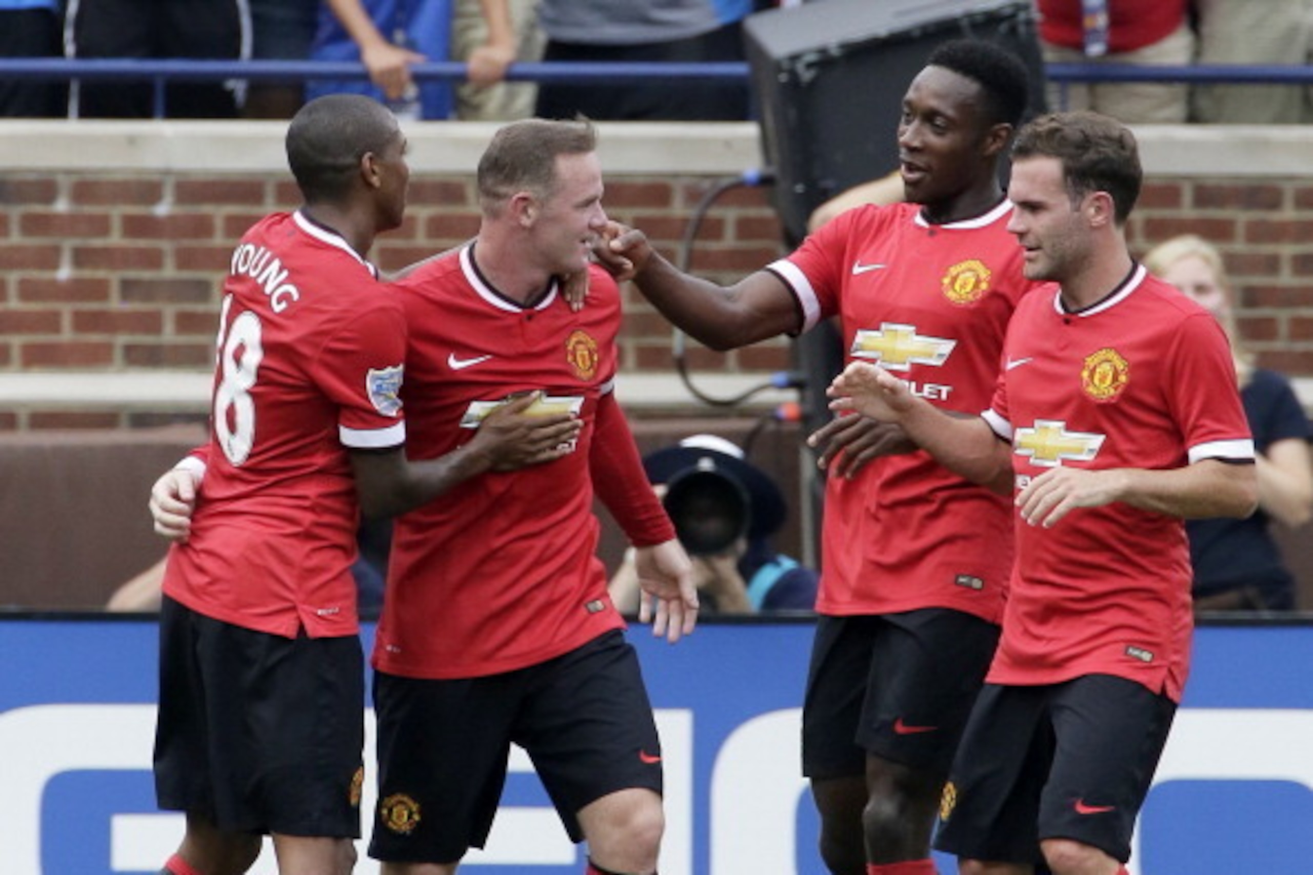 ANN ARBOR, MI - AUGUST 2: Wayne Rooney #10 of Manchester United is congratulated by Ashley Young #18 of Manchester United and teammates after scoring a goal against Real Madrid during the first half of the Guinness International Champions Cup at Michigan ANN ARBOR, MI - AUGUST 2: Wayne Rooney #10 of Manchester United is congratulated by Ashley Young #18 of Manchester United and teammates after scoring a goal against Real Madrid during the first half of the Guinness International Champions Cup at Michigan