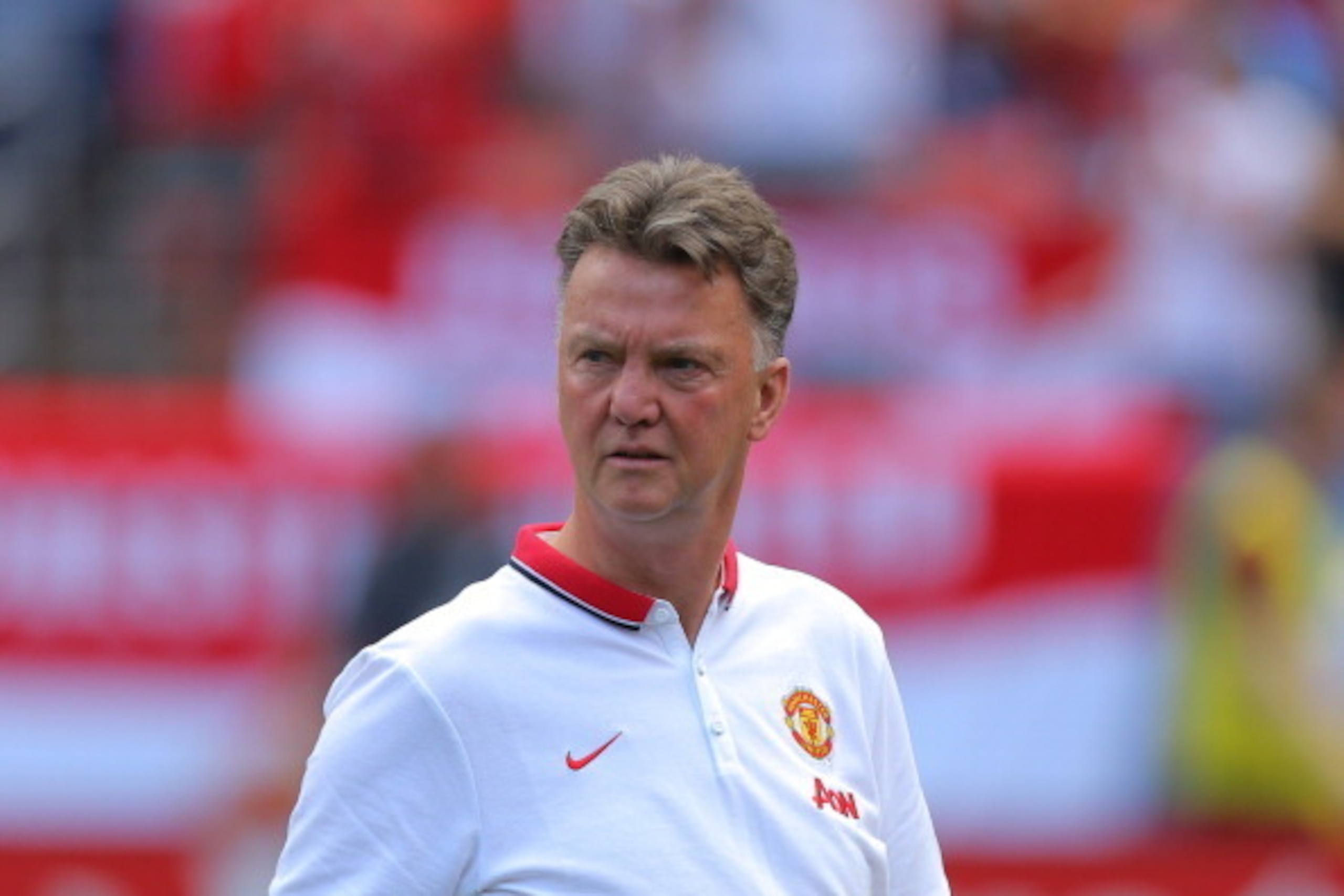 DENVER, CO - JULY 26: Manager Louis van Gaal walks on the pitch before a game against AS Roma during an International Champions Cup match at Sports Authority Field at Mile High on July 26, 2014 in Denver, Colorado. Manchester United defeated AS Roma 3-2. DENVER, CO - JULY 26: Manager Louis van Gaal walks on the pitch before a game against AS Roma during an International Champions Cup match at Sports Authority Field at Mile High on July 26, 2014 in Denver, Colorado. Manchester United defeated AS Roma 3-2.