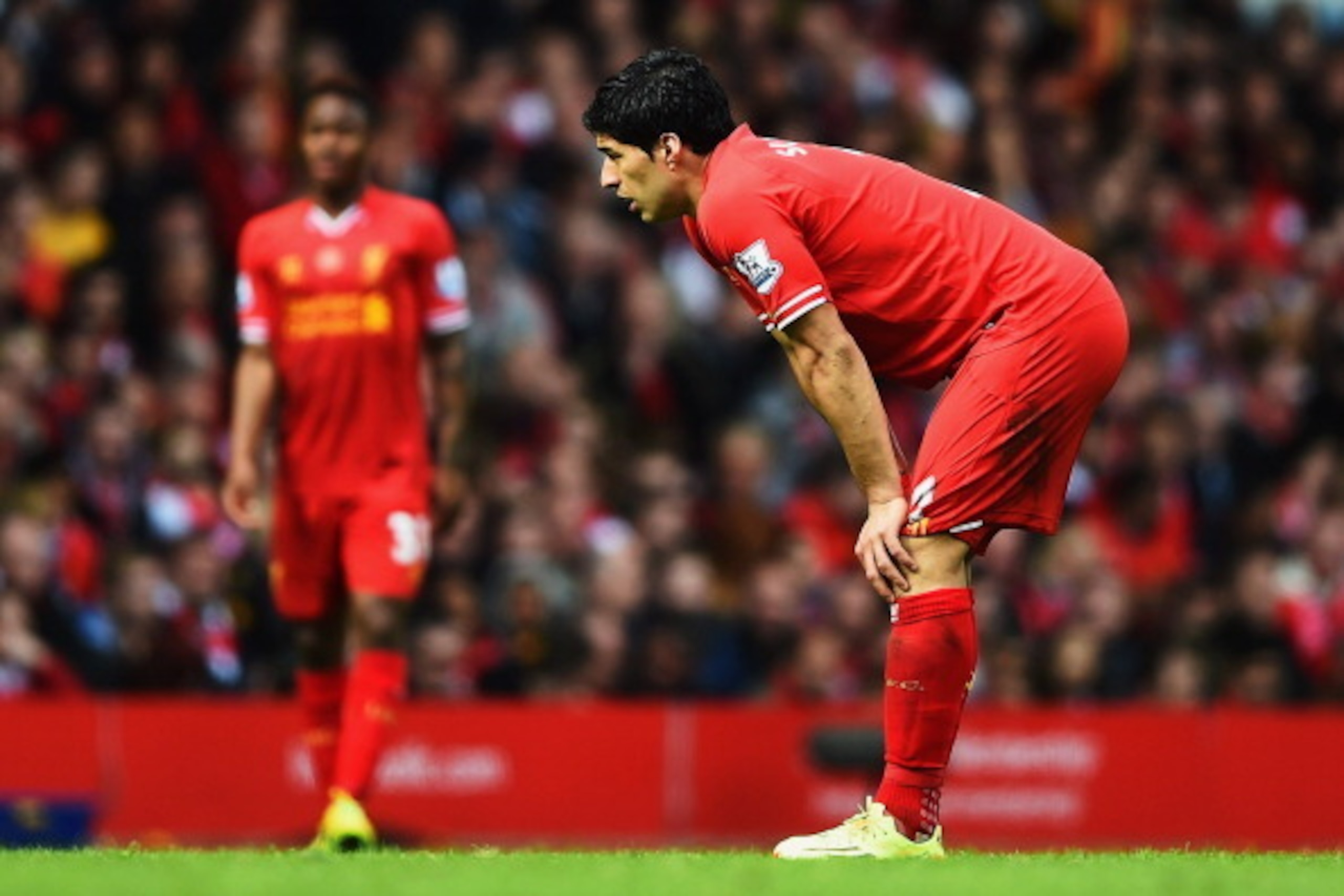 LIVERPOOL, ENGLAND - MAY 11:  Luis Suarez of Liverpool looks thoughtful during the Barclays Premier League match between Liverpool and Newcastle United at Anfield on May 11, 2014 in Liverpool, England.  (Photo by Laurence Griffiths/Getty Images)