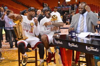 MIAMI, FL - JUNE 20:  Dwyane Wade #3 and LeBron James #6 of the Miami Heat talk with Shaquille O'Neal after defeating the San Antonio Spurs in Game Seven of the 2013 NBA Finals on June 20, 2013 at American Airlines Arena in Miami, Florida. NOTE TO USER: U