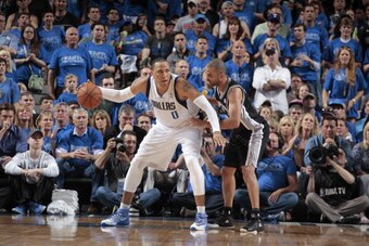 DALLAS, TX - APRIL 26:  Shawn Marion #0 of the Dallas Mavericks posts up against Tony Parker #9 of the San Antonio Spurs during Game Three of the Western Conference Quarterfinals during the 2014 NBA Playoffs on April 26, 2014 at the American Airlines Cent