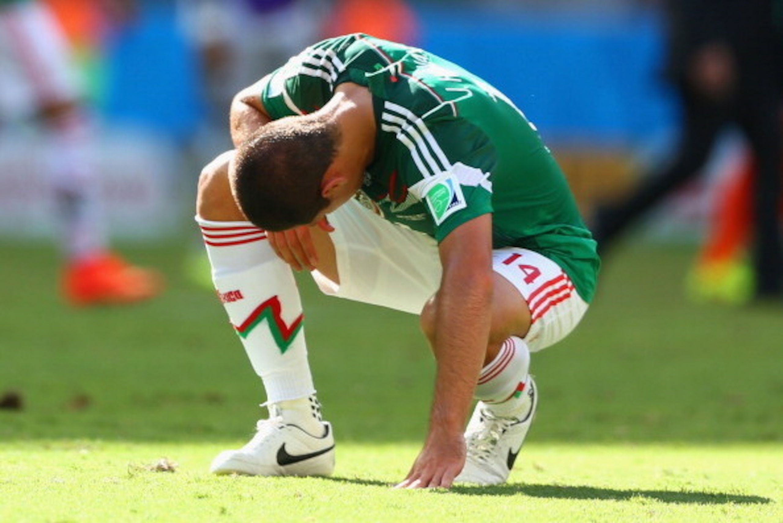FORTALEZA, BRAZIL - JUNE 29:  A dejected Javier Hernandez of Mexico looks on after being defeated by the Netherlands 2-1 during the 2014 FIFA World Cup Brazil Round of 16 match between Netherlands and Mexico at Castelao on June 29, 2014 in Fortaleza, Braz
