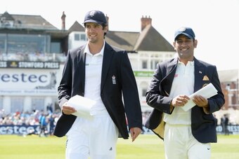 NOTTINGHAM, ENGLAND - JULY 09:  England captain Alastair Cook walks out for the toss alongside Mahendra Singh Dhoni of India ahead of day one of 1st Investec Test match between England and India at Trent Bridge on July 9, 2014 in Nottingham, England.  (Ph