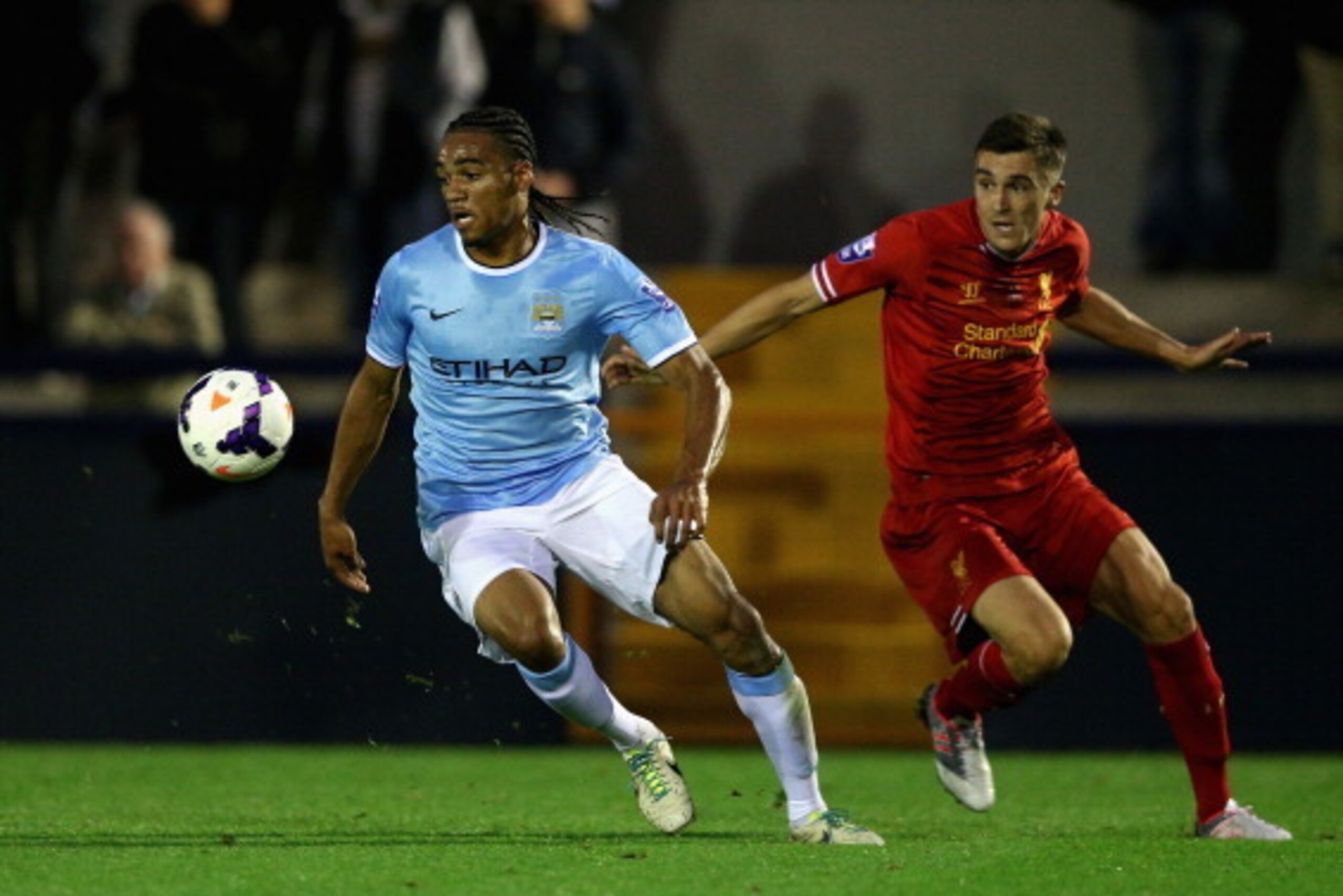 HYDE, ENGLAND - SEPTEMBER 23: Jason Denayer of Manchester City U21 in action with Adam Morgan of Liverpool U21 during the Barclays U21s Premier League match between Manchester City U21 and Liverpool U21 at Ewen Fields on September 23, 2013 in Hyde, Englan HYDE, ENGLAND - SEPTEMBER 23: Jason Denayer of Manchester City U21 in action with Adam Morgan of Liverpool U21 during the Barclays U21s Premier League match between Manchester City U21 and Liverpool U21 at Ewen Fields on September 23, 2013 in Hyde, Englan