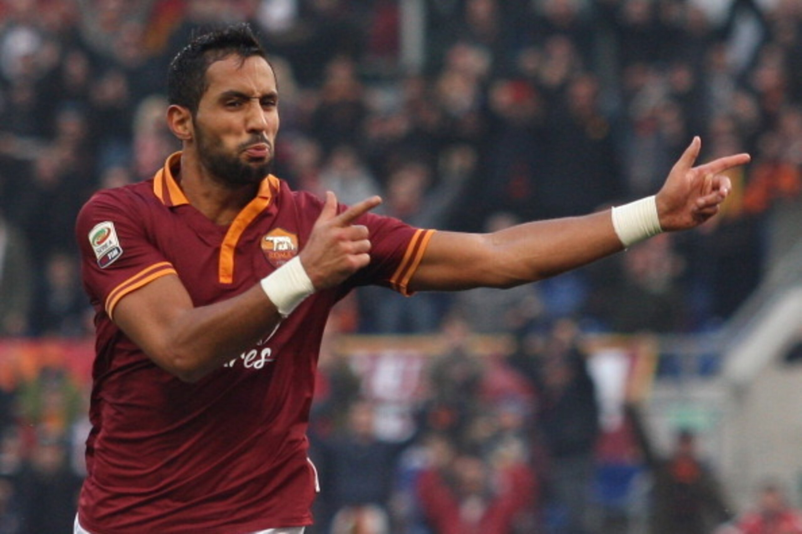ROME, ITALY - DECEMBER 22:  Mehdi Benatia of AS Roma celebrates after scoring the third team's goal during the Serie A match between AS Roma and Calcio Catania at Stadio Olimpico on December 22, 2013 in Rome, Italy.  (Photo by Paolo Bruno/Getty Images)