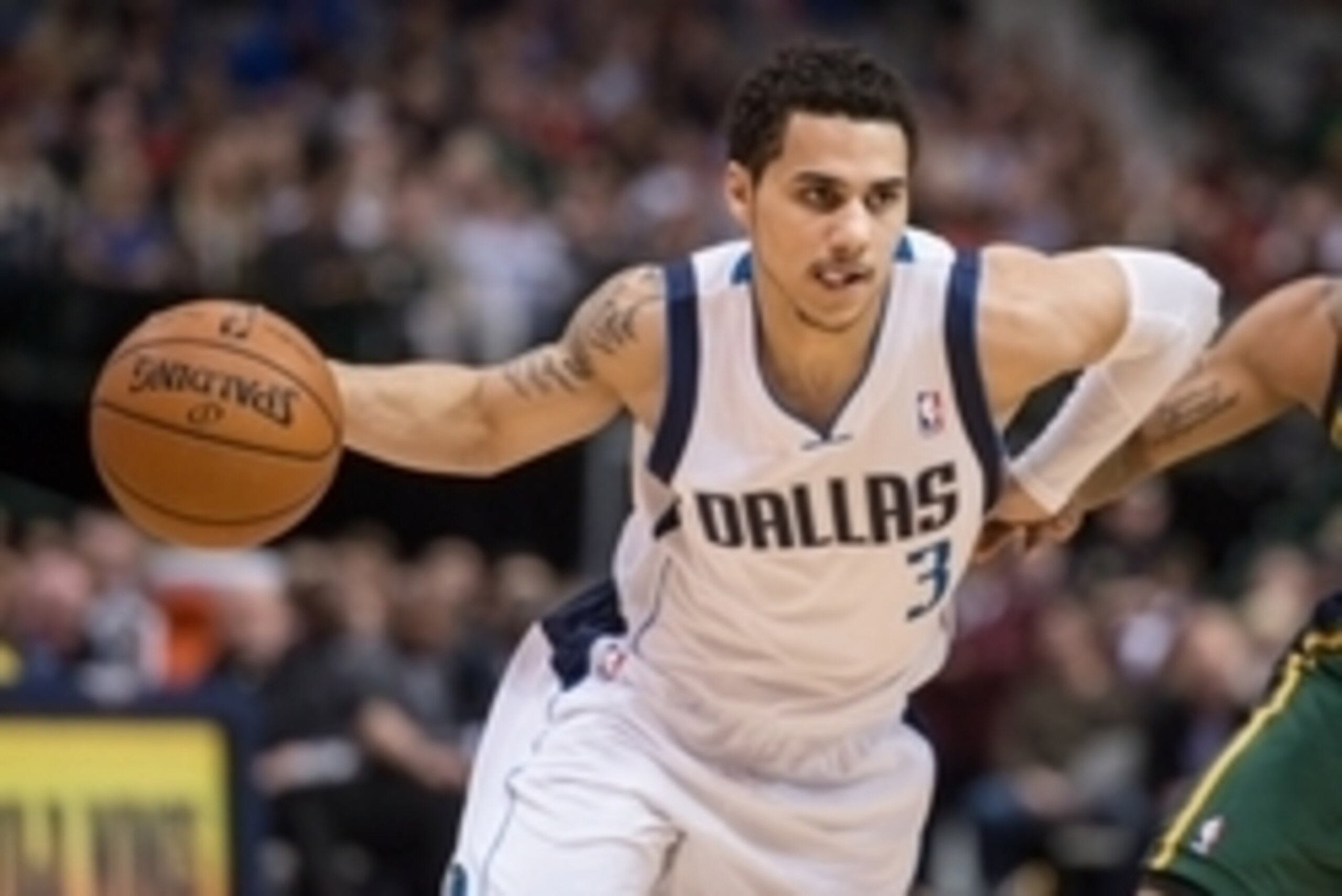 Feb 7, 2014; Dallas, TX, USA; Dallas Mavericks point guard Shane Larkin (3) drives to the basket during the game against the Utah Jazz at the American Airlines Center. The Mavericks defeated the Jazz 103-81. Mandatory Credit: Jerome Miron-USA TODAY Sports