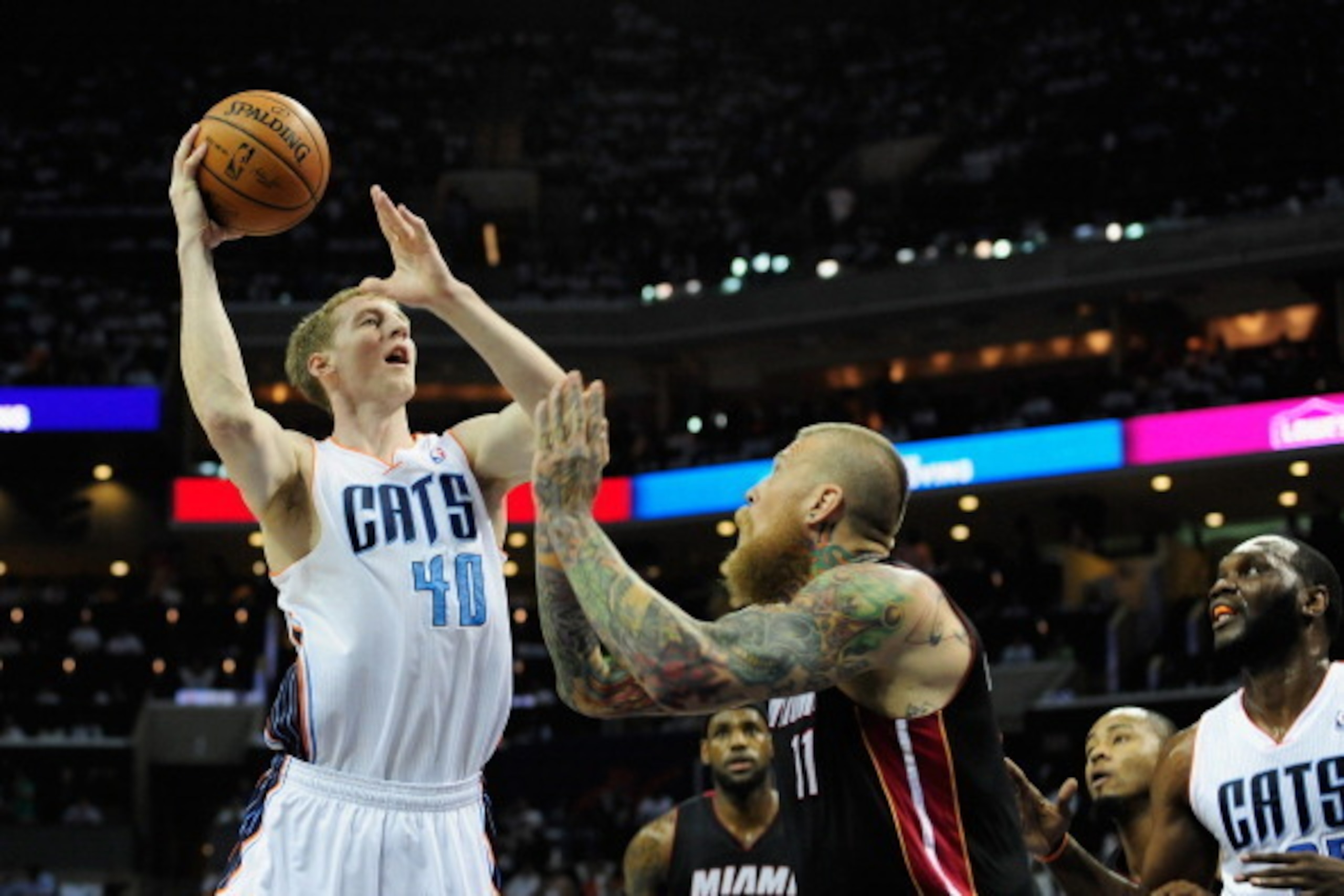 CHARLOTTE, NC - APRIL 26:  Cody Zeller #40 of the Charlotte Bobcats shoots over Chris Andersen #11 of the Miami Heat in Game Three of the Eastern Conference Quarterfinals during the 2014 NBA Playoffs at Time Warner Cable Arena on April 26, 2014 in Charlot