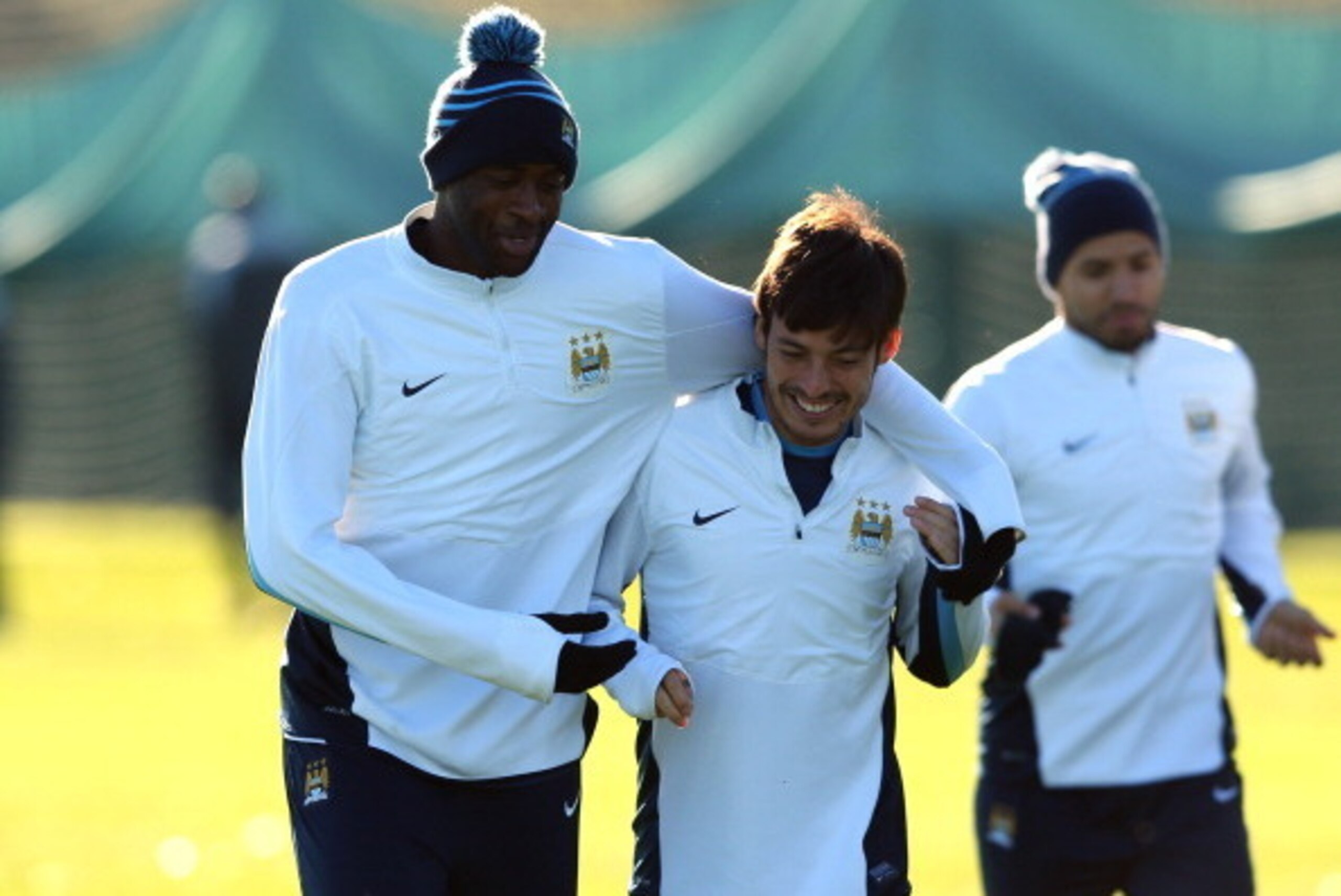 MANCHESTER, ENGLAND - NOVEMBER 04:  Yaya Toure and David Silva of Manchester City joke around during a training session at Carrington Training Ground on November 4, 2013 in Manchester, England.  (Photo by Alex Livesey/Getty Images)