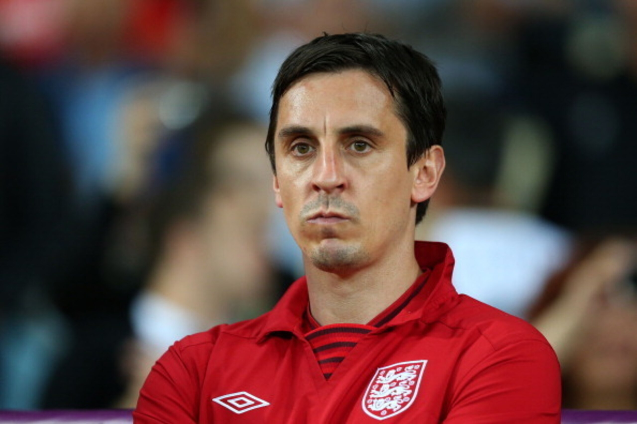 KIEV, UKRAINE - JUNE 15: Assistant coach Gary Neville of England looks on during the UEFA EURO 2012 group D match between Sweden and England at The Olympic Stadium on June 15, 2012 in Kiev, Ukraine.  (Photo by Alex Livesey/Getty Images)