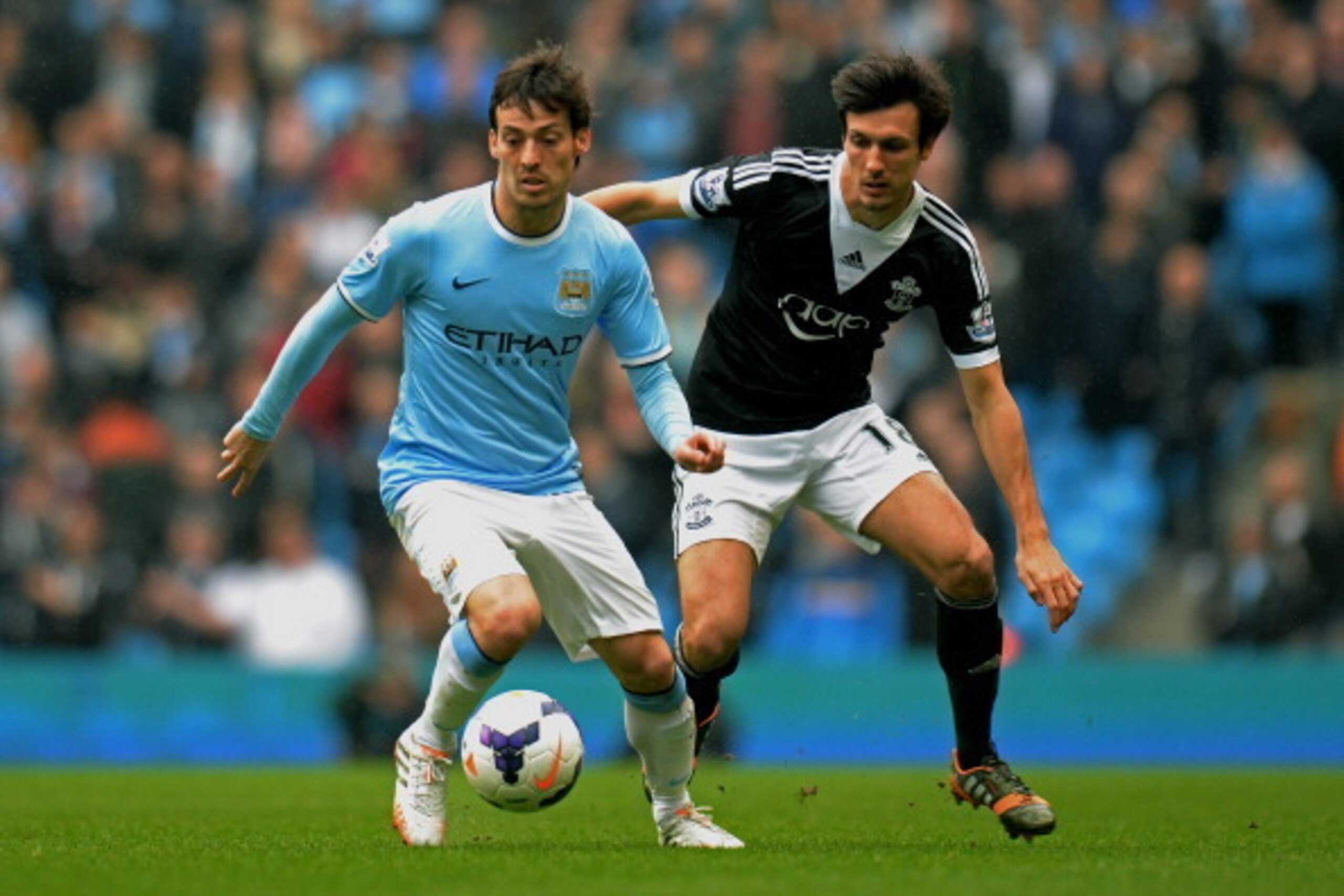 MANCHESTER, ENGLAND - APRIL 05: David Silva of Manchester City is challenged by Jack Cork of Southampton during the Barclays Premier League match between Manchester City and Southampton at Etihad Stadium on April 5, 2014 in Manchester, England. (Photo b MANCHESTER, ENGLAND - APRIL 05: David Silva of Manchester City is challenged by Jack Cork of Southampton during the Barclays Premier League match between Manchester City and Southampton at Etihad Stadium on April 5, 2014 in Manchester, England. (Photo b