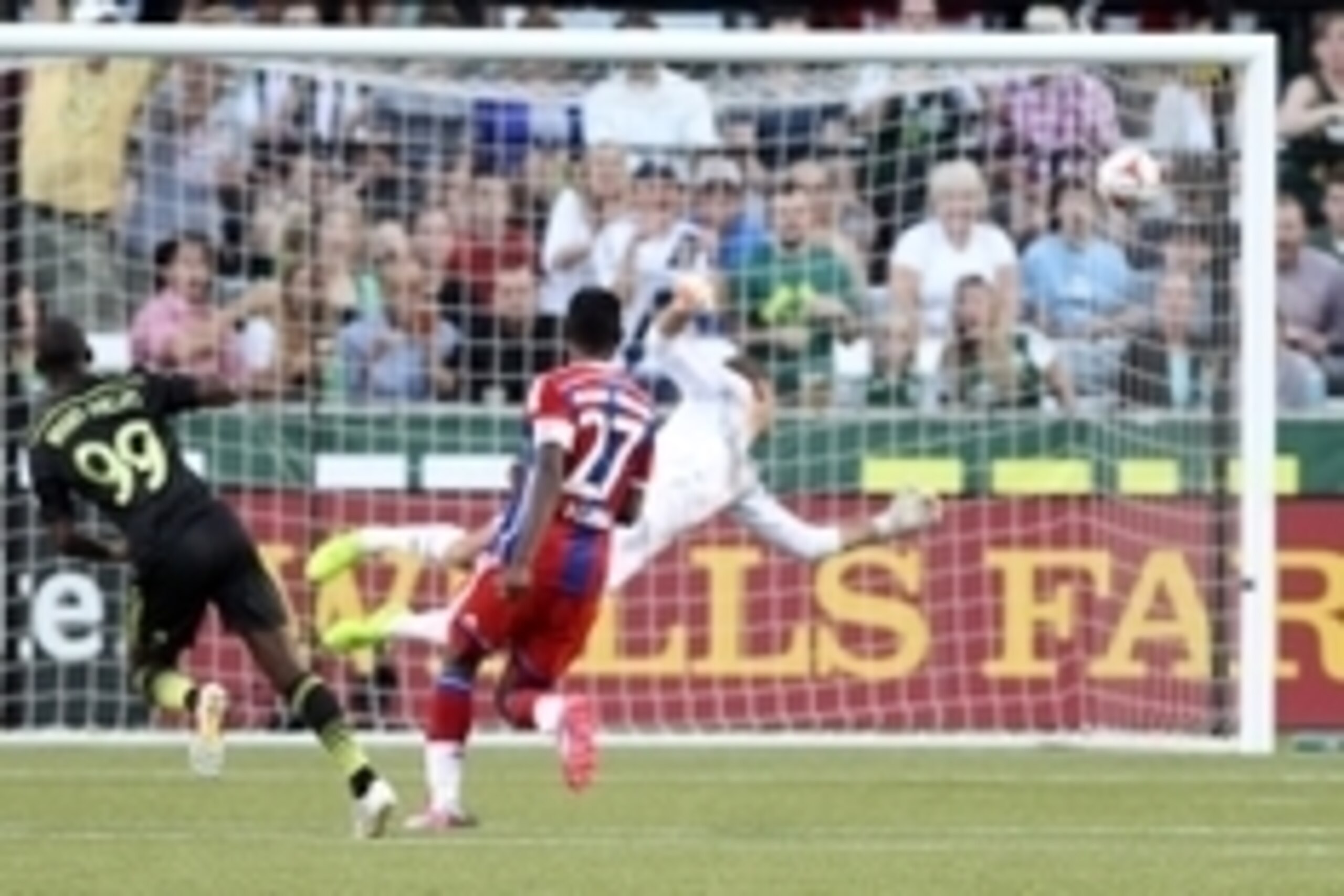 Aug 6, 2014; Portland, OR, USA; MLS All Stars forward Bradley Wright-Phillips (99) of the New York Red Bulls scores a goal past Bayern Munich goalkeeper Tom Starke (22) during the 2014 MLS All Star Game at Providence Park. Mandatory Credit: Jaime Valdez-U