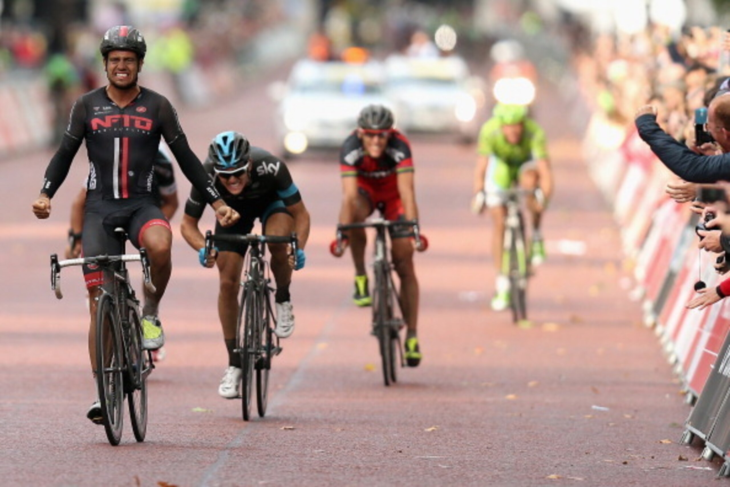 LONDON, ENGLAND - AUGUST 10: Adam Blythe (l) of Great Britain and NFTO celebrates after winning the Prudential RideLondon-Surrey Classic from the Queen Elizabeth Olympic Park to The Mall on August 10, 2014 in London, England. (Photo by Bryn Lennon/Getty LONDON, ENGLAND - AUGUST 10: Adam Blythe (l) of Great Britain and NFTO celebrates after winning the Prudential RideLondon-Surrey Classic from the Queen Elizabeth Olympic Park to The Mall on August 10, 2014 in London, England. (Photo by Bryn Lennon/Getty