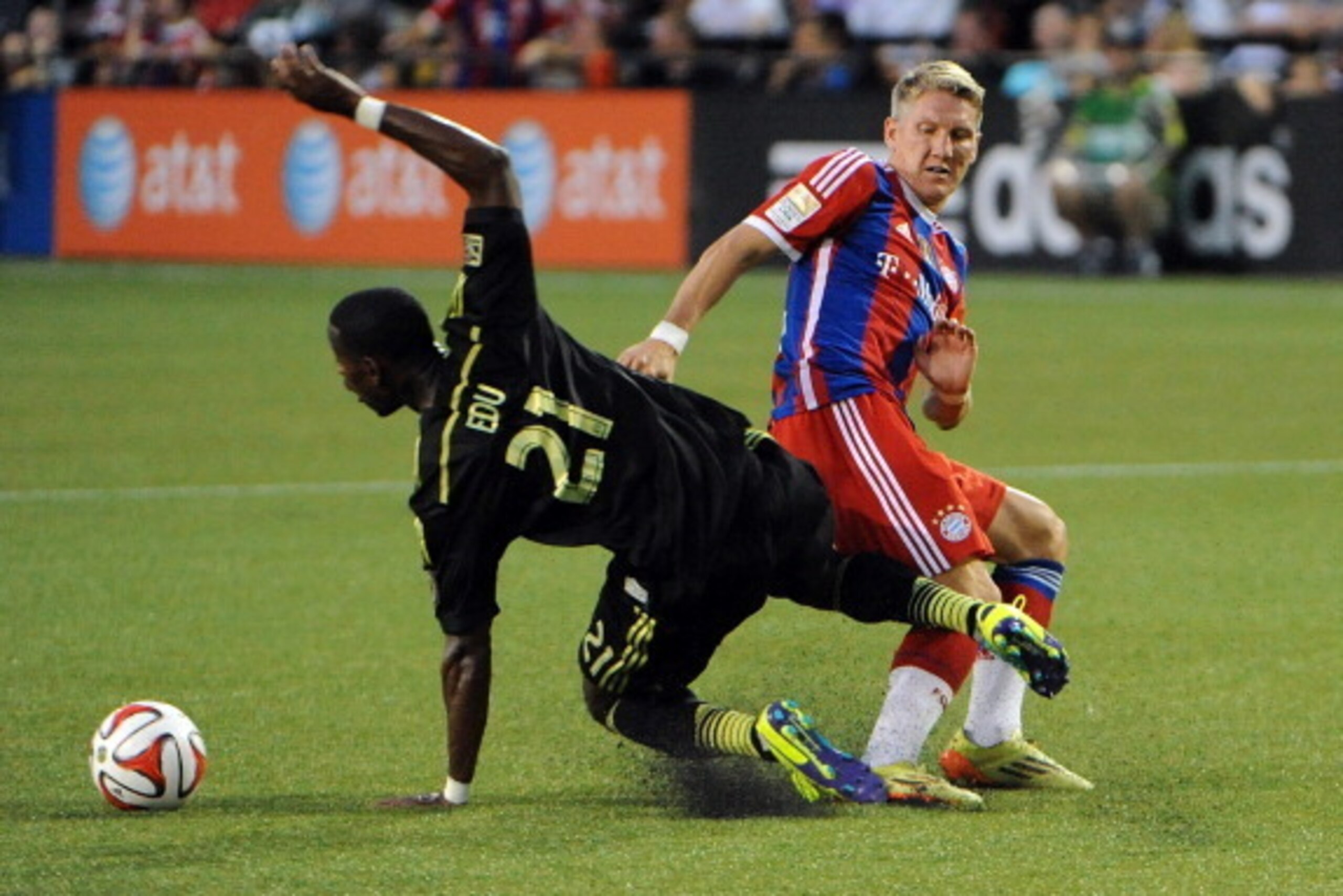 PORTLAND, OR - AUGUST 06: Bastian Schweinsteiger #31 of Bayern Munich gets tangled up with Maurice Edu #21 of the MLS All-Stars duing the second half of the game at Providence Park on August 6, 2014 in Portland, Oregon.  (Photo by Steve Dykes/Getty Images