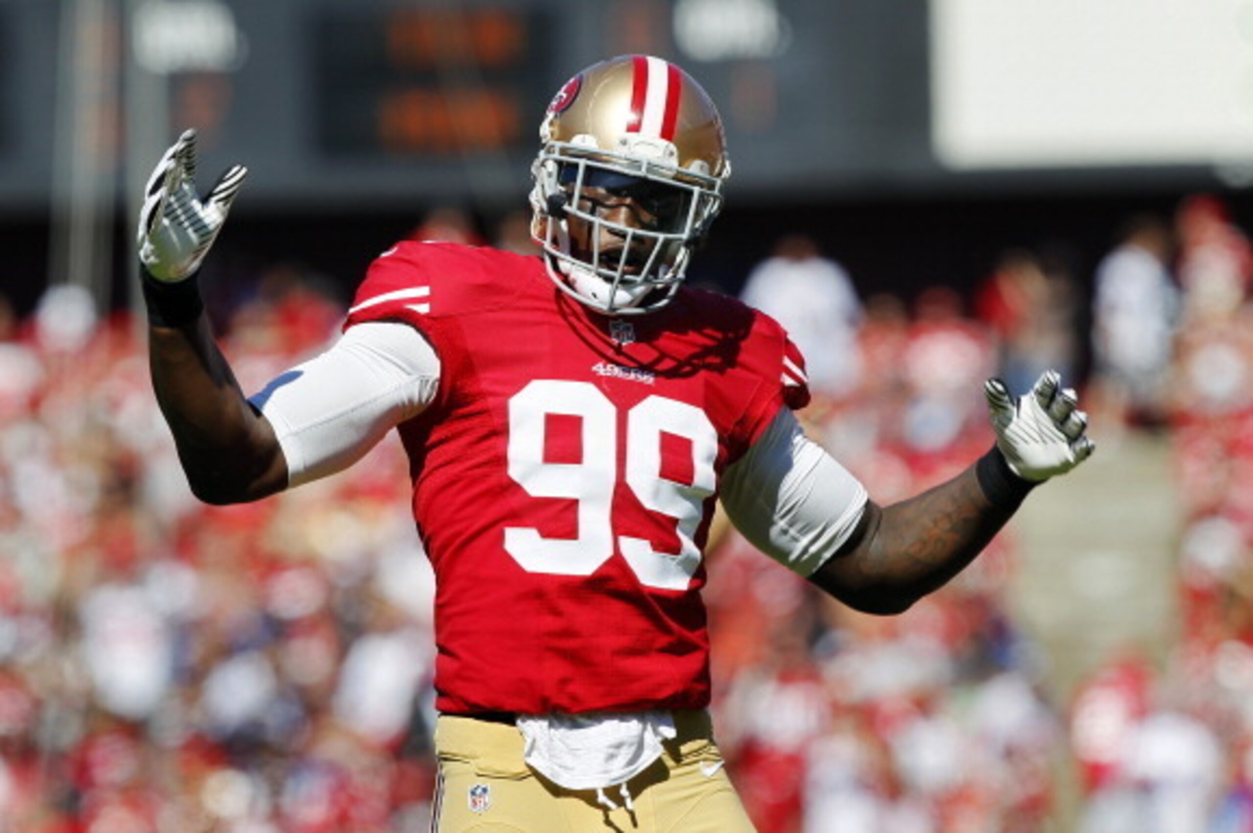 SAN FRANCISCO, CA - OCTOBER 7: Linebacker Aldon Smith #99 of the San Francisco 49ers tries to amp up the crowd before a snap by the Buffalo Bills in the first quarter on October 7, 2012 at Candlestick Park in San Francisco, California.    (Photo by Brian 