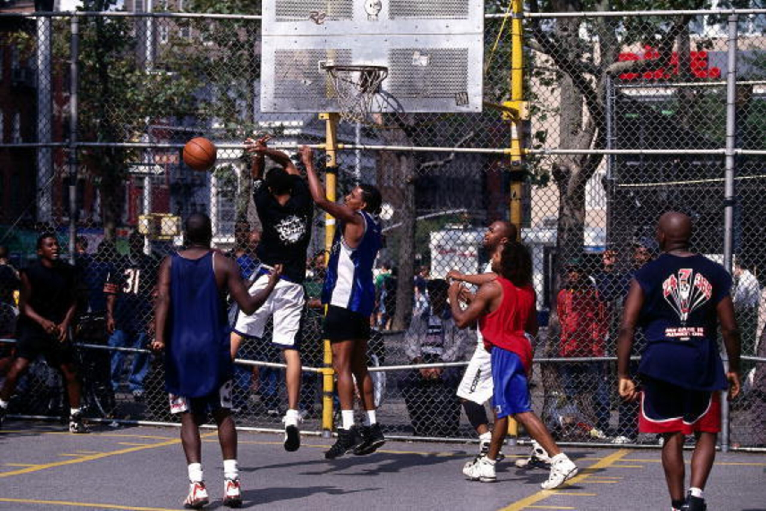 NEW YORK - SEPTEMBER 13: Players battle for a rebound during a pick-up game at a playground on West 4th Street on September 13, 1997 in New York. NOTE TO USER: User expressly acknowledges  and agrees that, by downloading and or using this  photograph, Use
