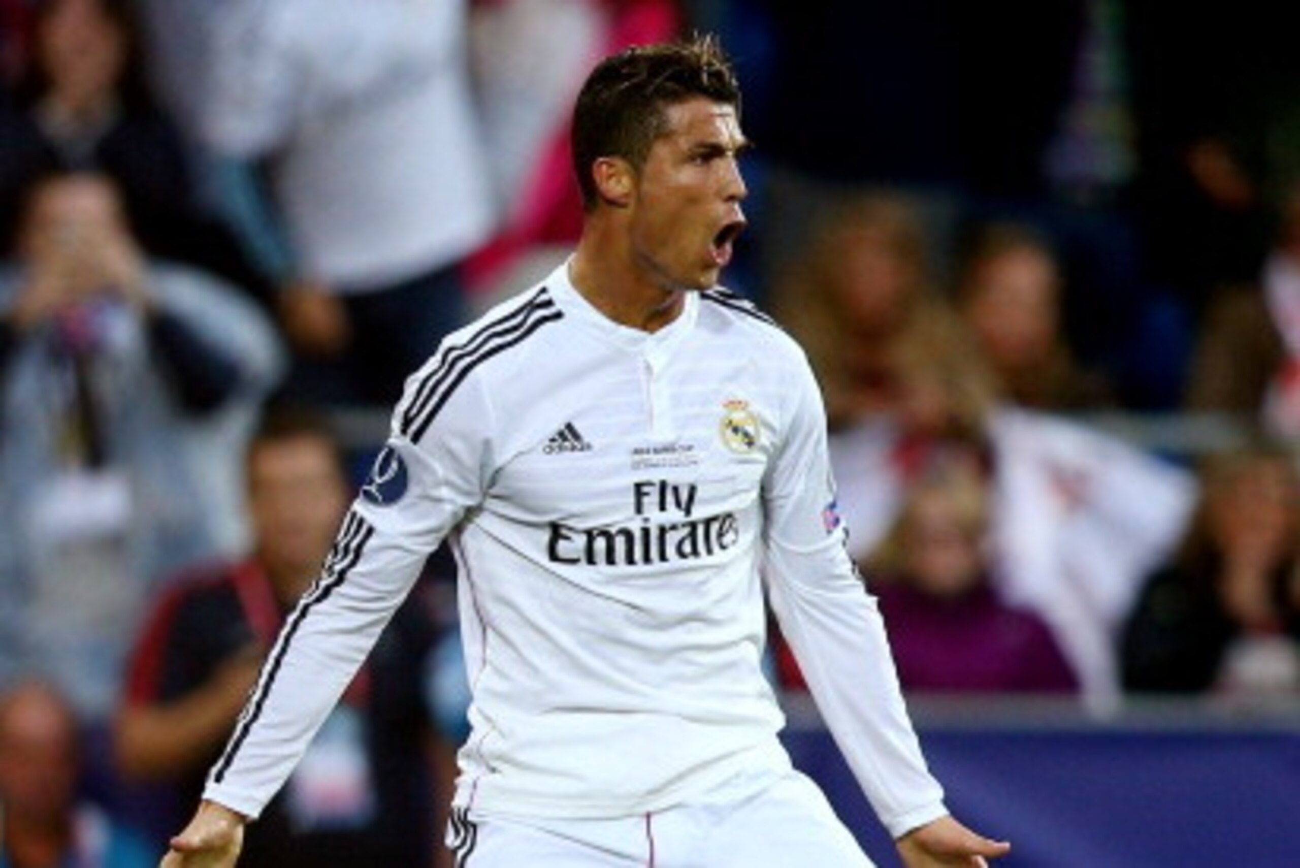 CARDIFF, WALES - AUGUST 12:  Cristiano Ronaldo of Real Madrid celebrates after scoring the opening goal during the UEFA Super Cup between Real Madrid and Sevilla FC at Cardiff City Stadium on August 12, 2014 in Cardiff, Wales.  (Photo by Clive Mason/Getty