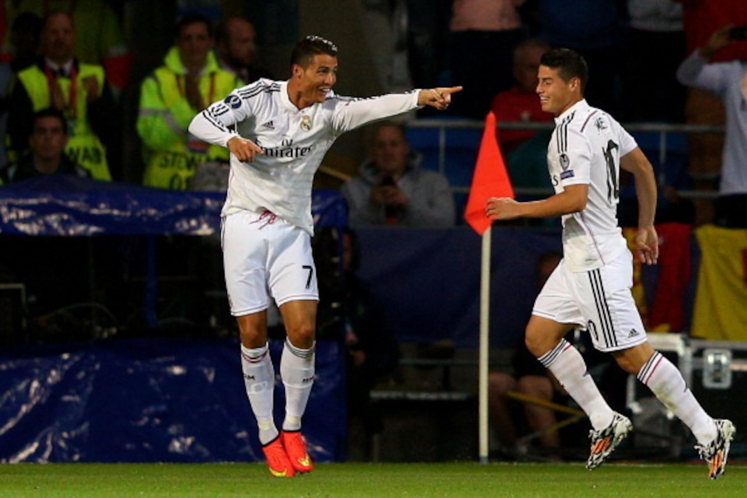 CARDIFF, WALES - AUGUST 12:  (L-R) Cristiano Ronaldo of Real Madrid celebrates with teammate James Rodriguez after scoring their team's second goal during the UEFA Super Cup between Real Madrid and Sevilla FC at Cardiff City Stadium on August 12, 2014 in 