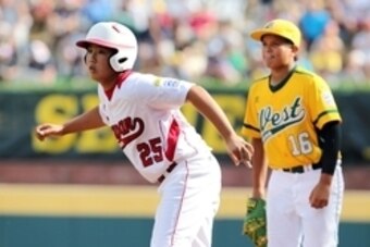 Aug 25, 2013; Williamsport, PA, USA; Japan Kyousuke Kobayashi (25) takes a lead off of first base during the third inning against California (West) during the Little League World Series Championship game at Lamade Stadium. Mandatory Credit: Matthew O'Hare