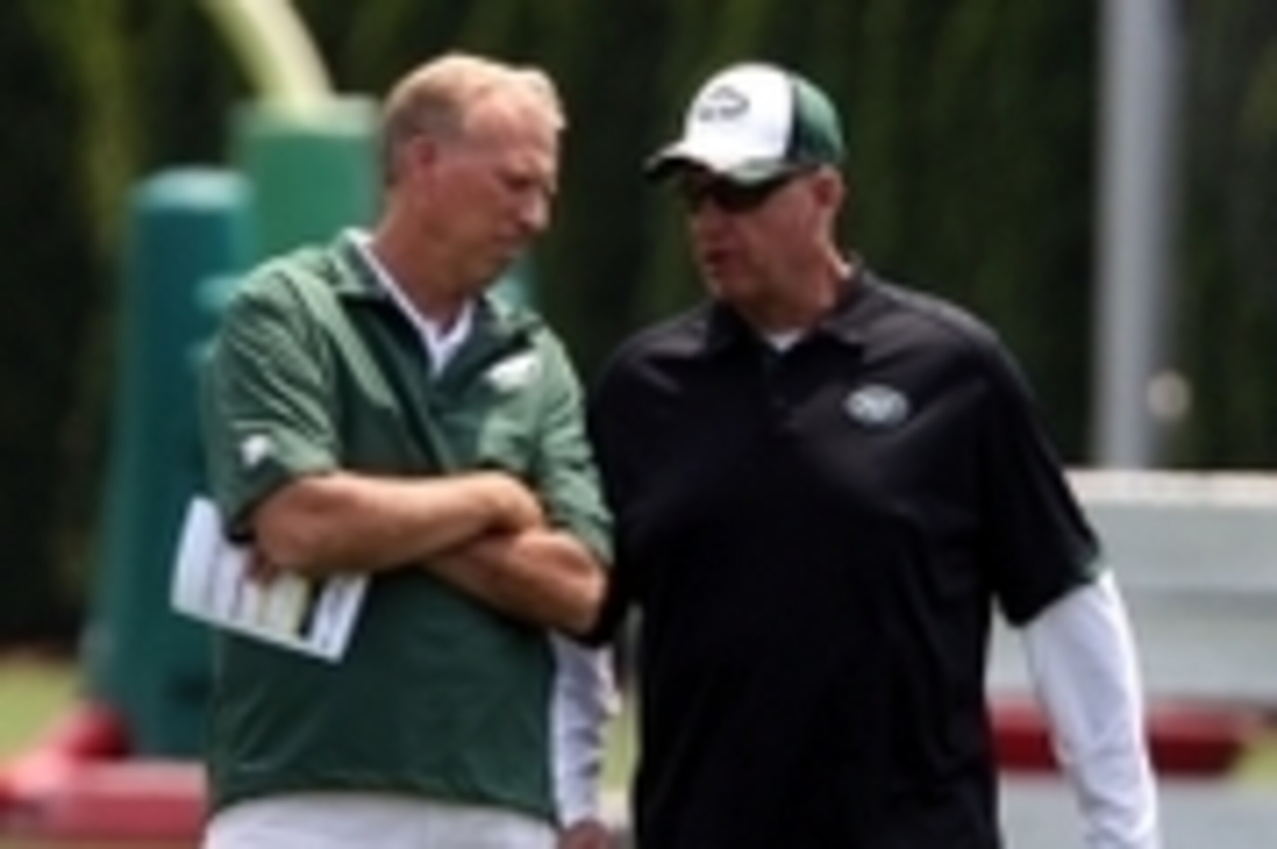 Jun 17, 2014; Florham Park, NJ, USA; New York Jets general manager John Idzik (left) and coach Rex Ryan during minicamp at Atlantic Health Training Center. Mandatory Credit: Noah K. Murray-USA TODAY Sports